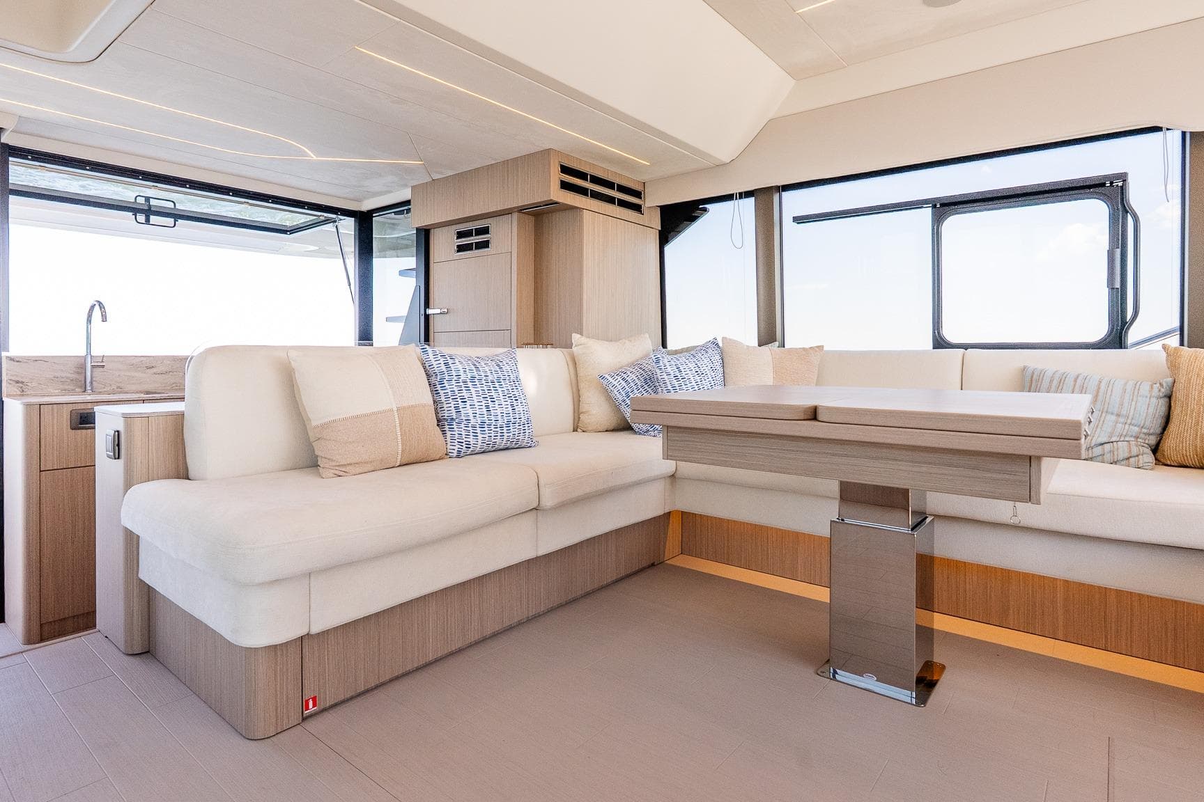 Luxurious interior of 2026 Prestige F5.7 yacht with modern seating and elegant decor.