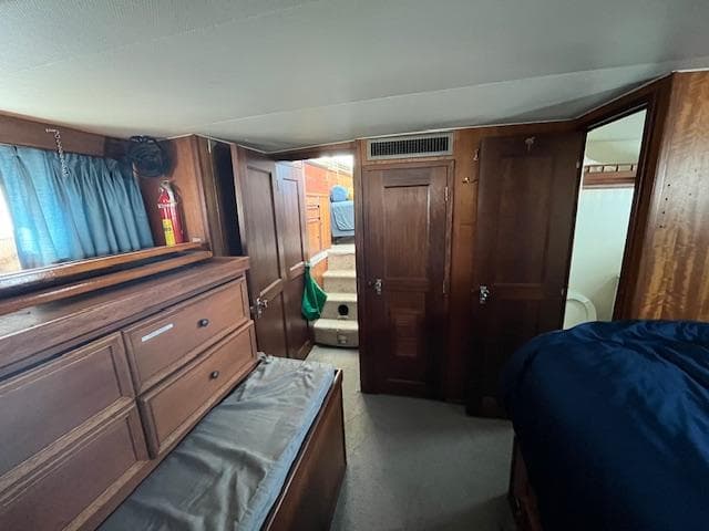 Interior of 1977 Hatteras 43 Double Cabin with wood paneling and storage.