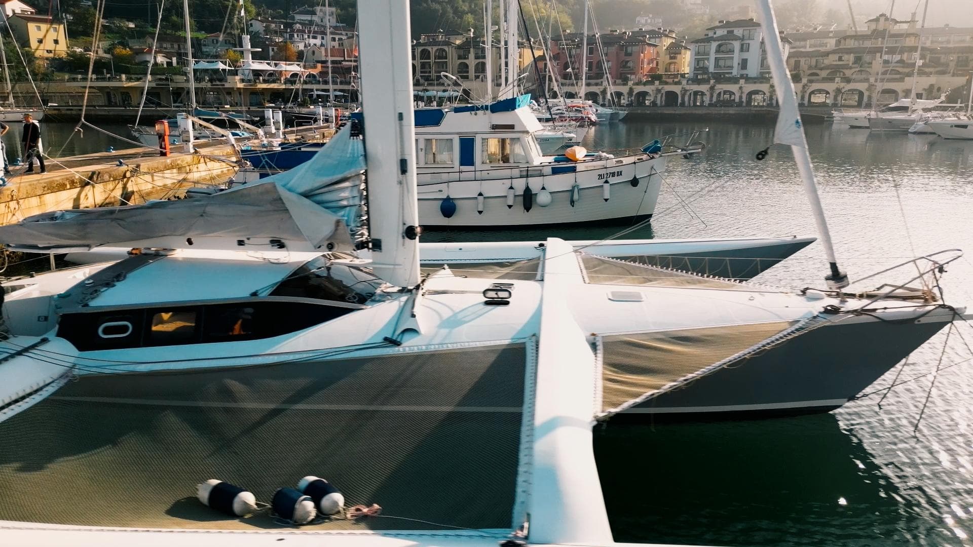 Shuttleworth 58 Custom yacht docked in a scenic marina, 2001 model.