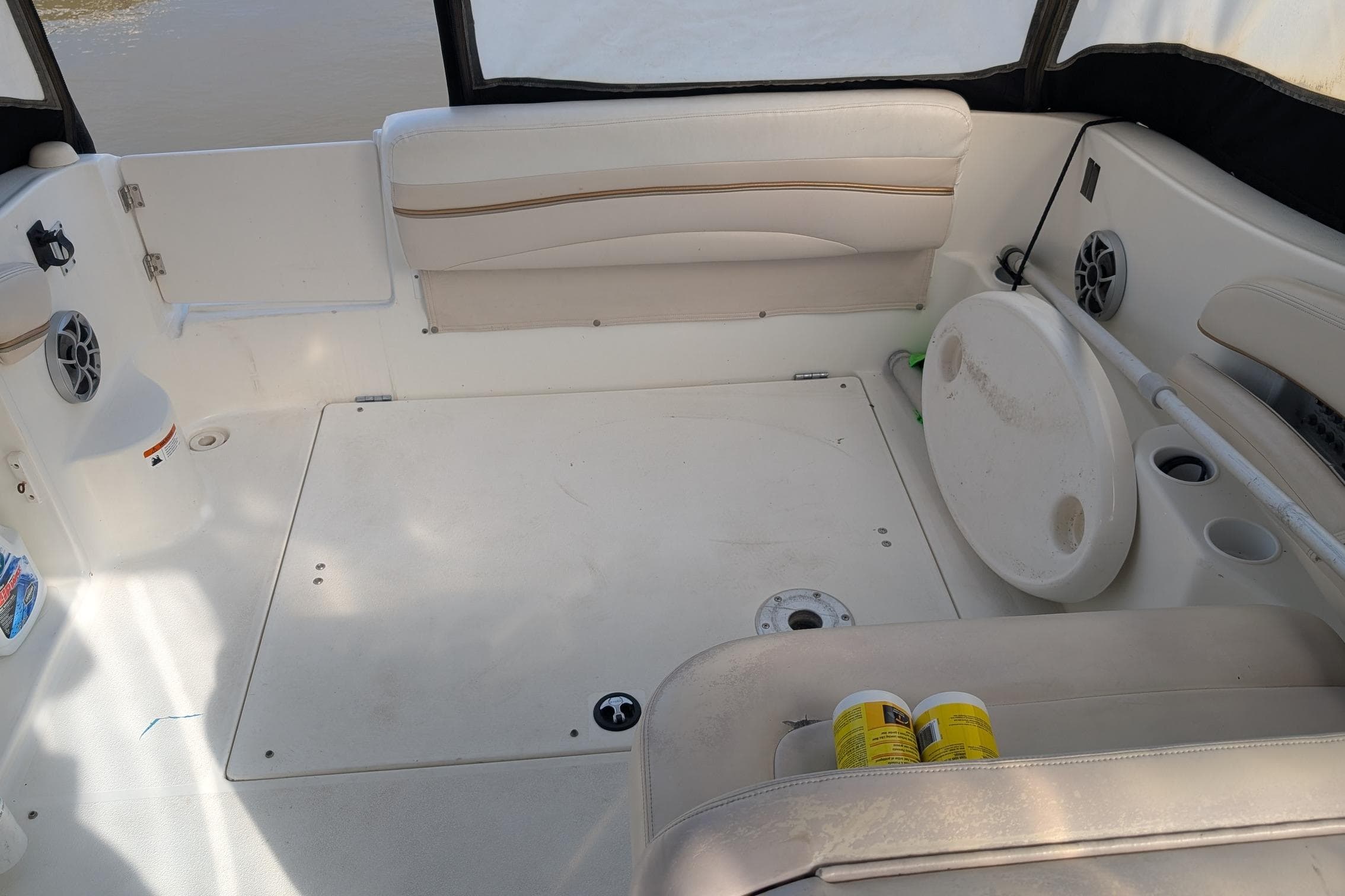 2004 Larson Cabrio 260 boat interior with seating, speakers, and storage compartments.