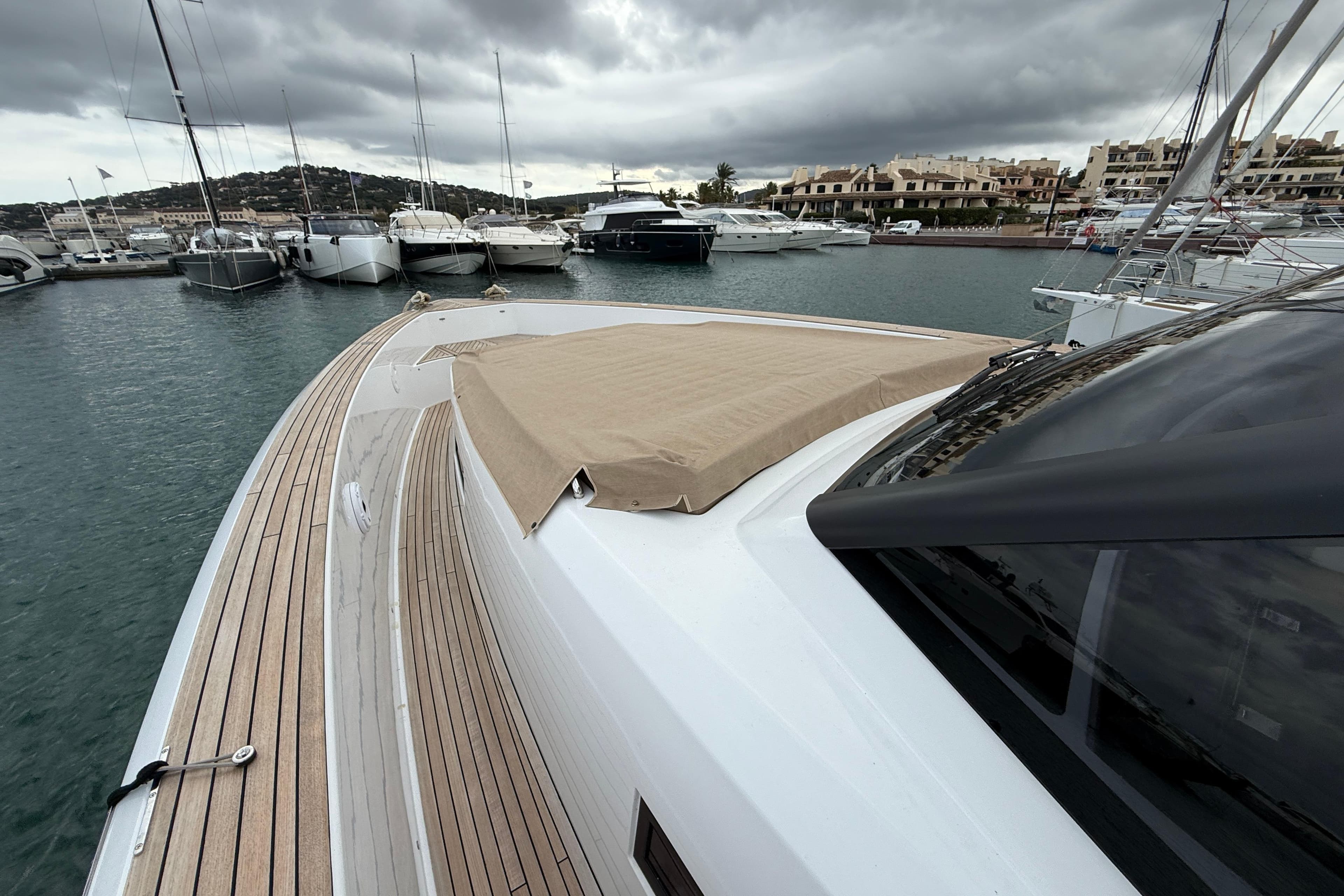 2024 Pardo P50 yacht docked in a marina under cloudy skies.
