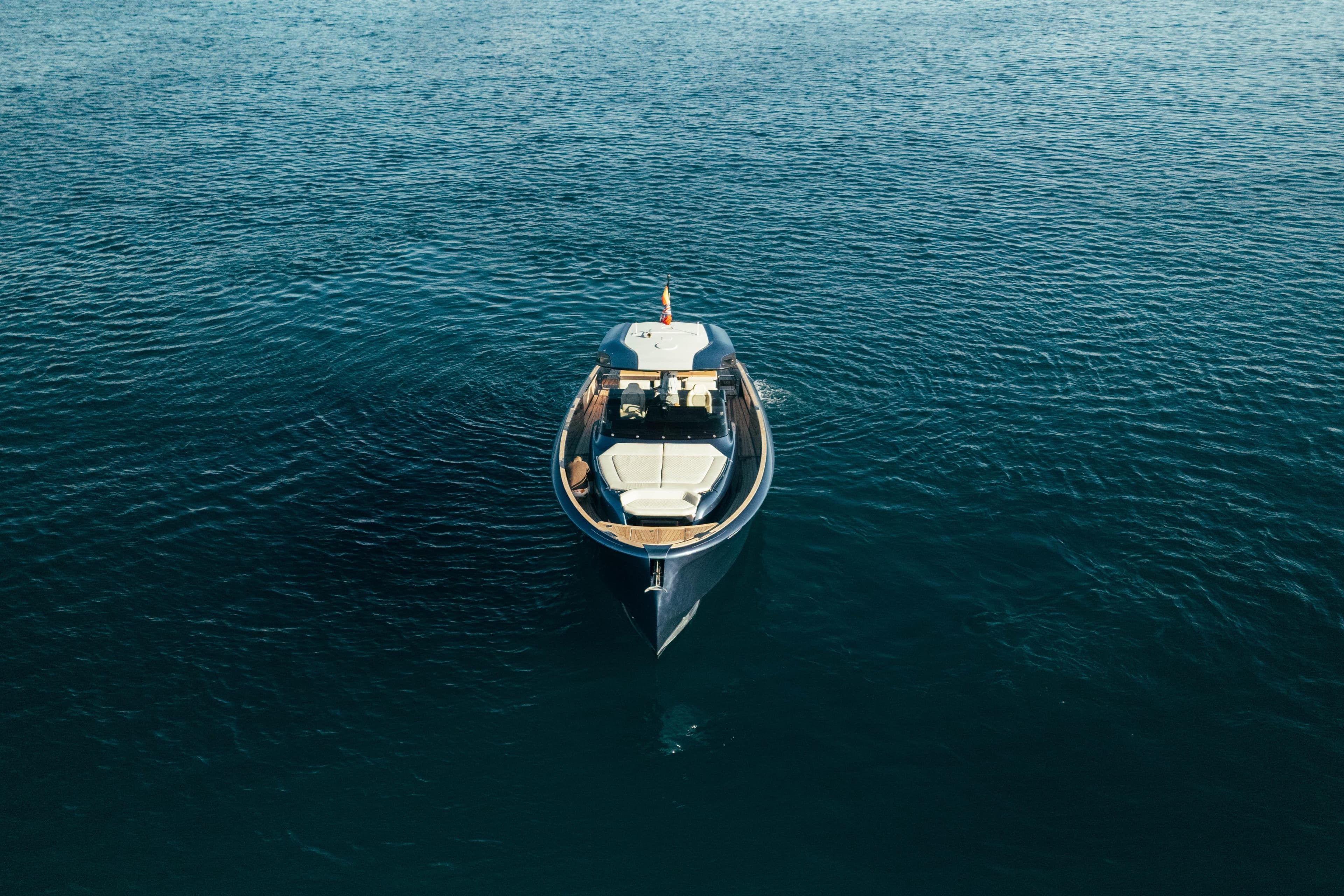 2023 Solaris Power 44 Open yacht on calm blue water, aerial view.
