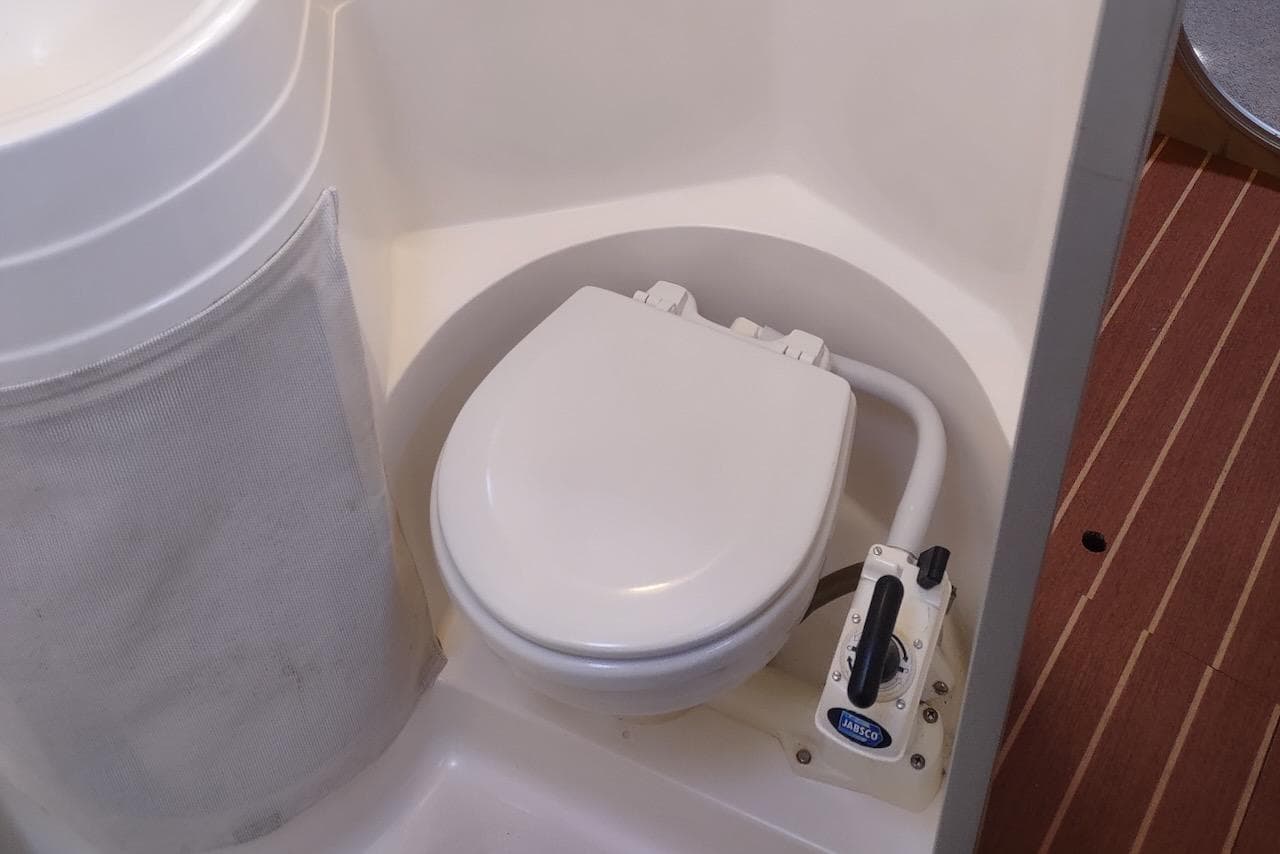 Marine toilet in 1996 Fountaine Pajot Venezia 42 catamaran bathroom.