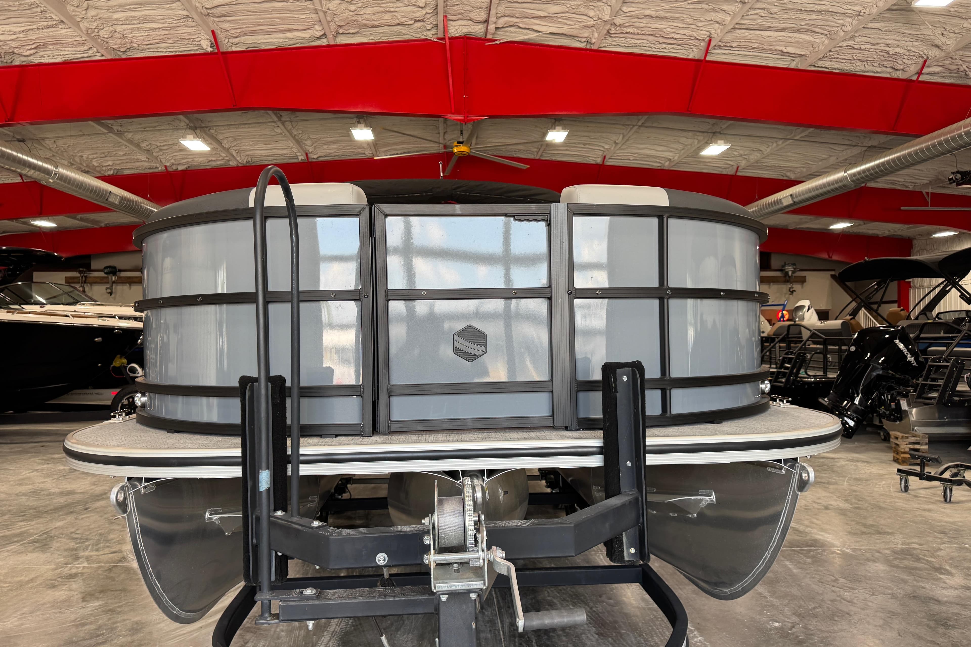 2026 South Bay S220CR2 pontoon boat in a warehouse.