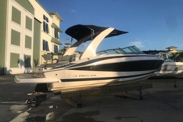 2012 Regal 2500 Bowrider boat on display in a marina setting.