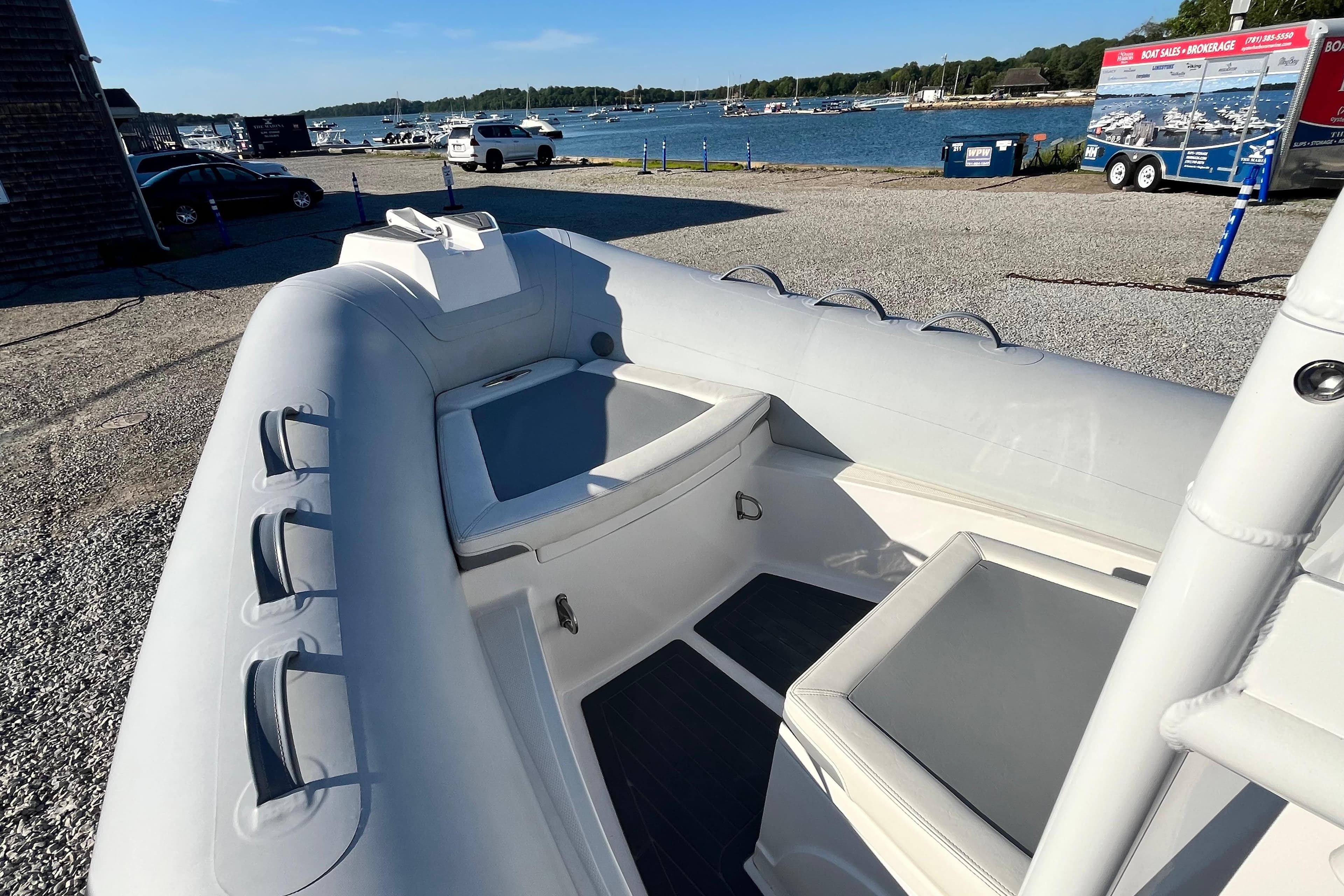2023 Inmar 550R-YS Yacht Series inflatable boat docked by the waterfront.