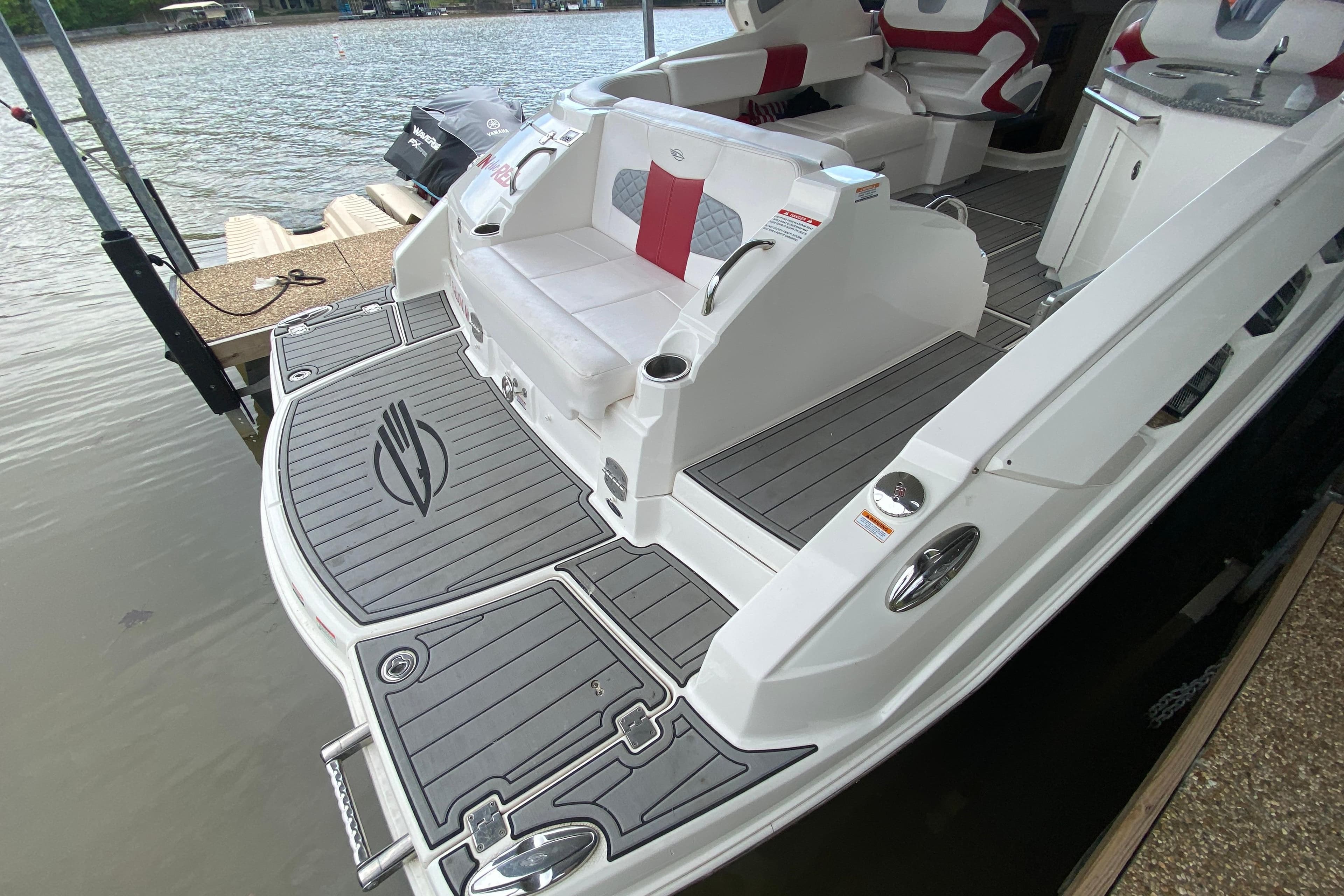 2012 Chaparral 327 SSX boat with sleek deck design and comfortable seating.
