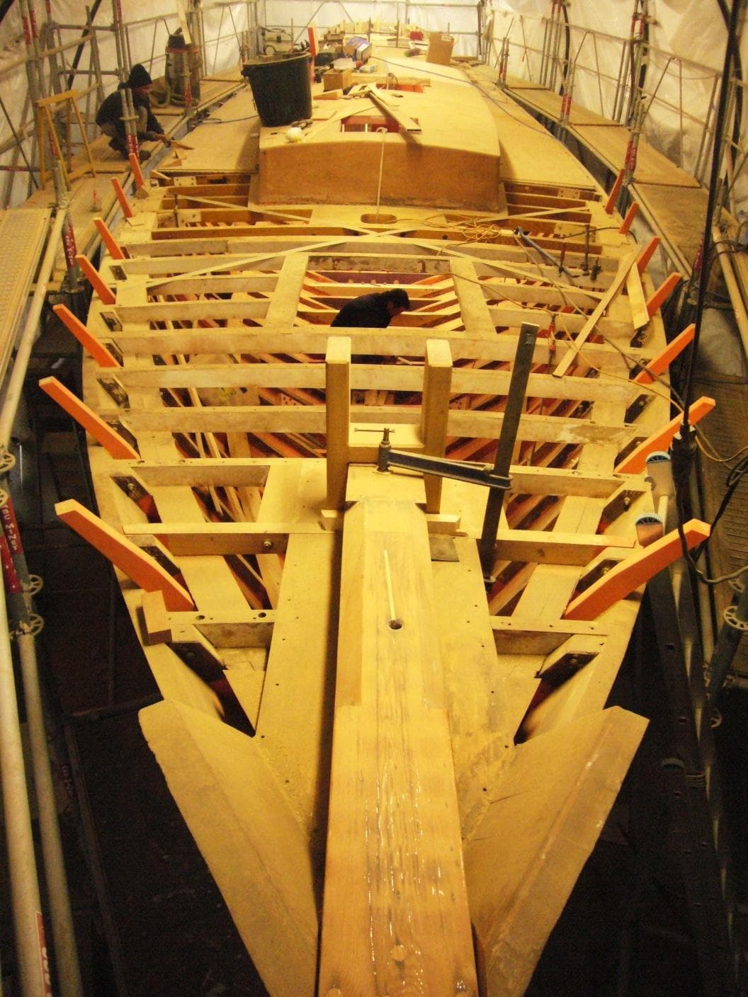 1953 Herreshoff 58 yacht under construction, wooden framework visible.