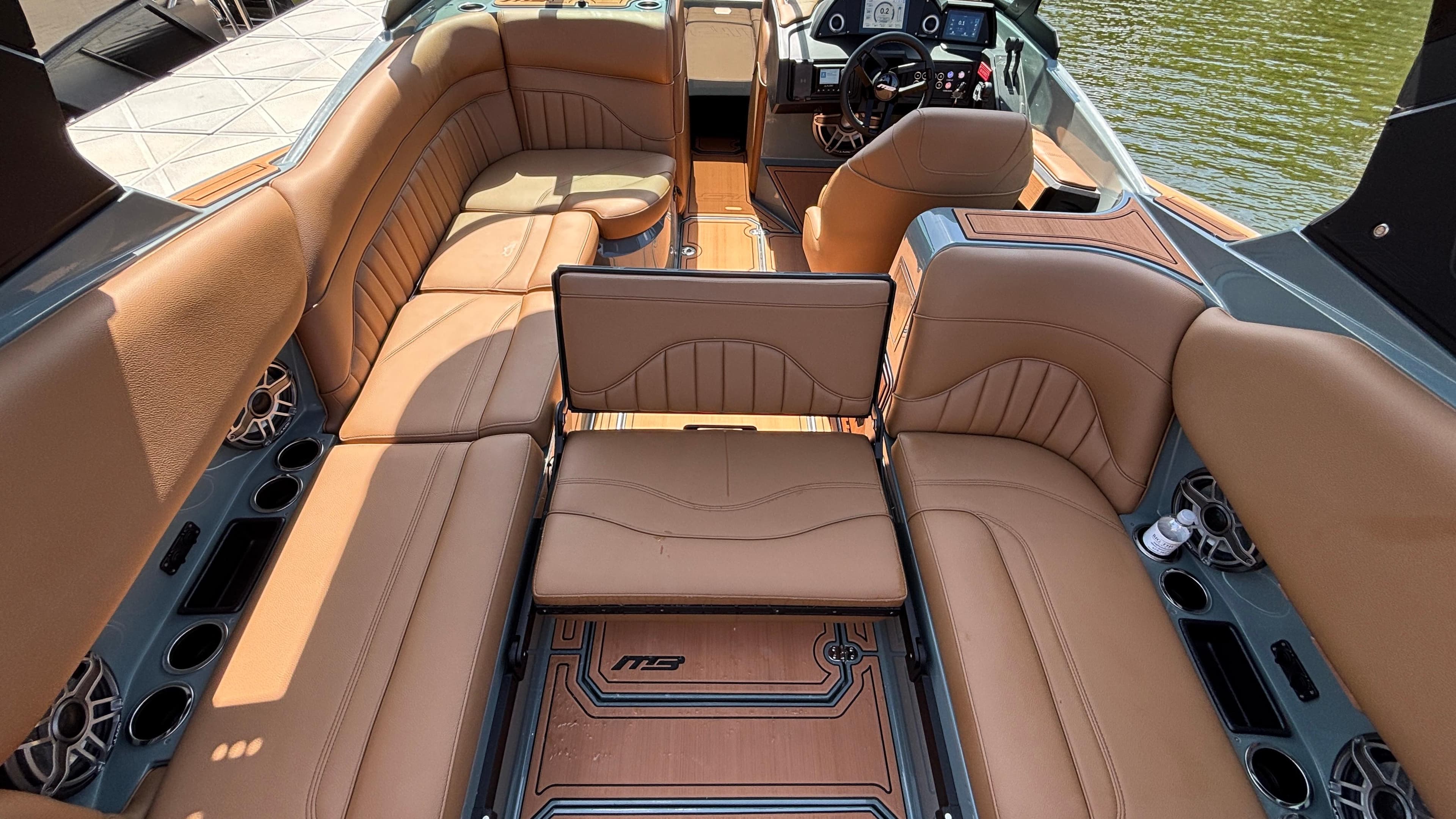Luxurious interior of 2025 MB B52 25 Alpha boat with tan leather seating.