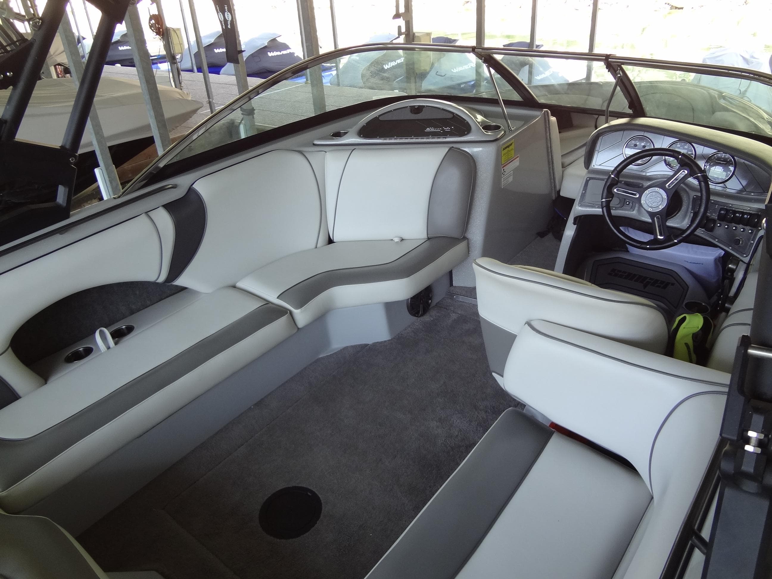 2022 Sanger V237 S boat interior with sleek seating and modern dashboard.