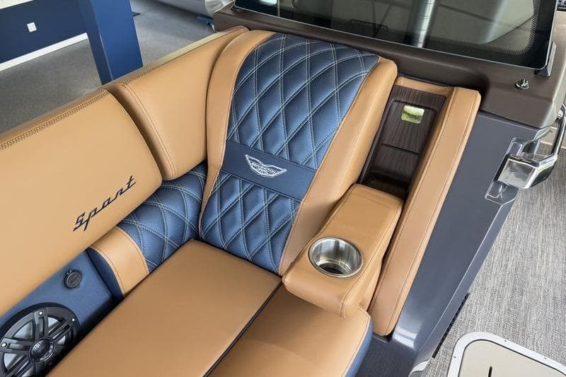 Luxurious seating in 2026 Bennington Q 25 QFBA boat with tan and blue upholstery.