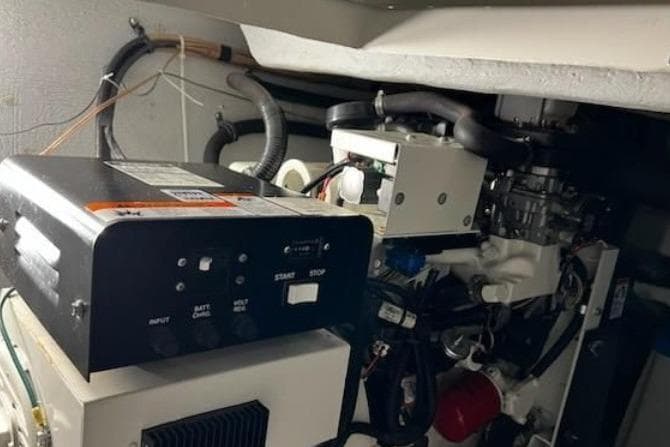 Engine room of a 2003 Meridian 381 Sedan boat, showcasing mechanical components.