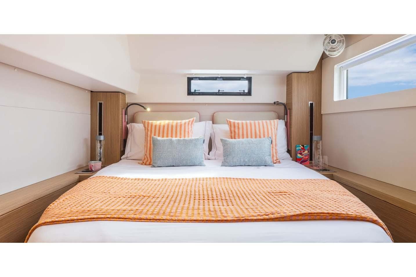 Manufacturer Provided Image: Luxurious bedroom interior of 2026 Lagoon 46 Iconic yacht with stylish bedding and modern design.