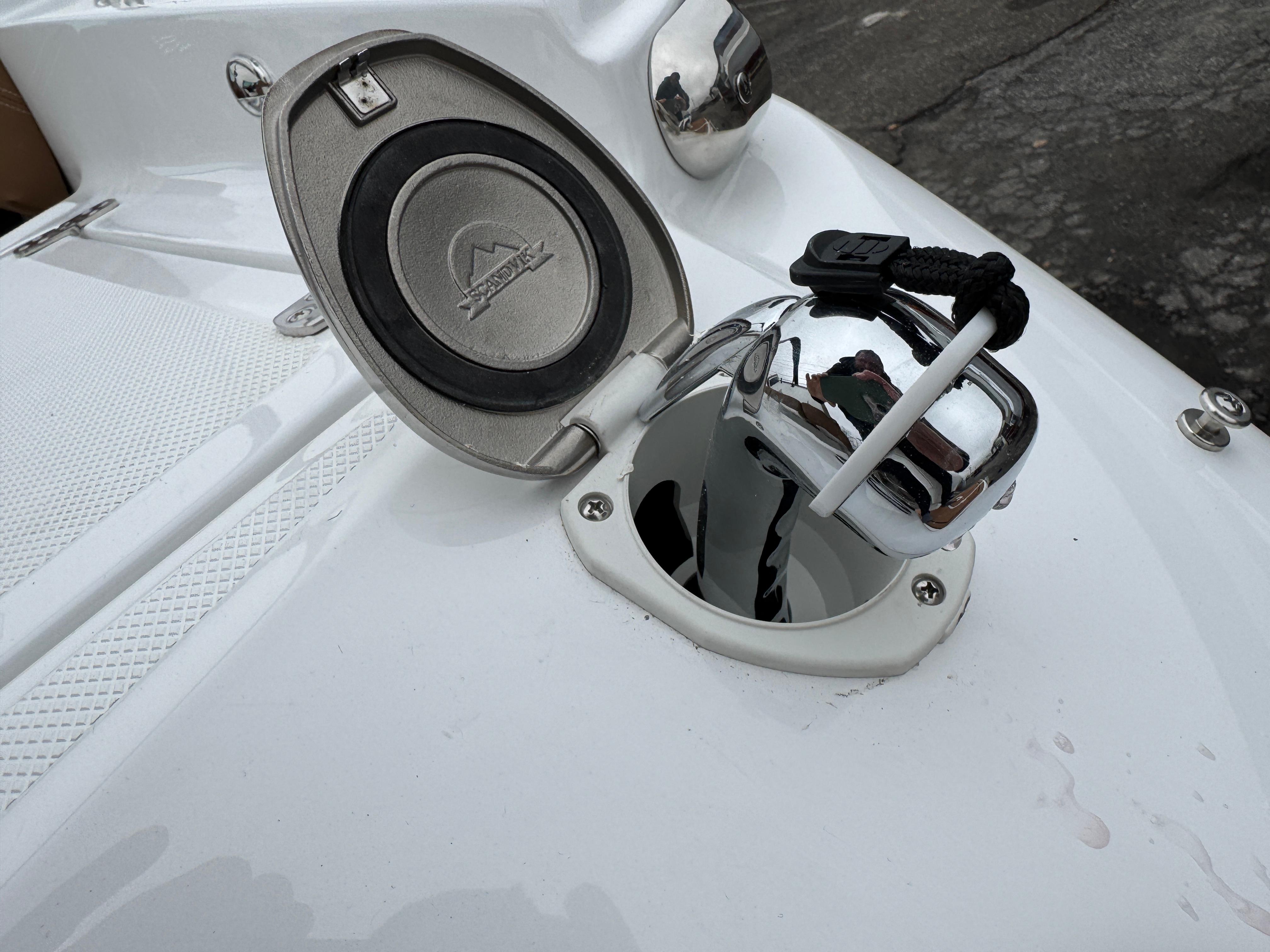 2025 Four Winns H2 OB boat anchor compartment with open lid.