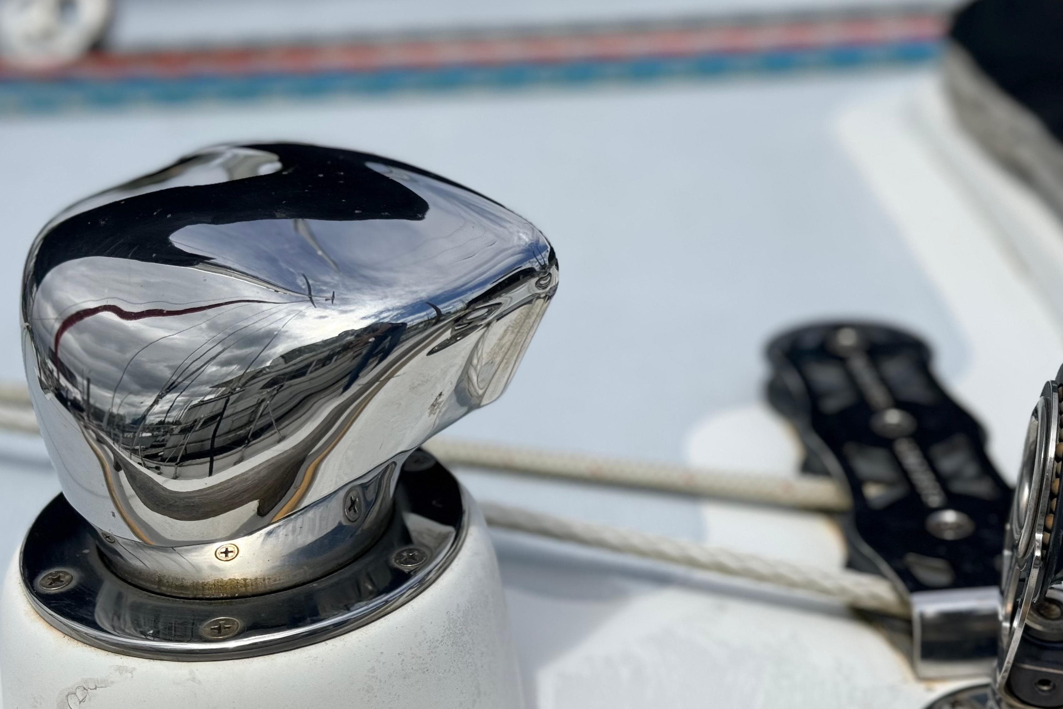 Close-up of a polished winch on a 1983 Tanton 44 sailboat deck.