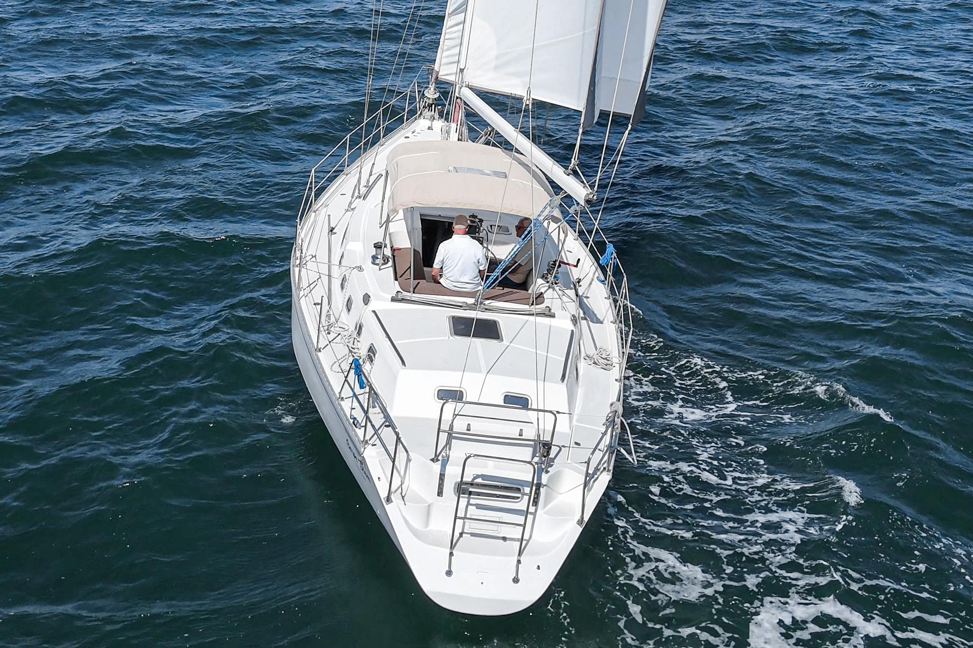 Sailing yacht Morgan 45 Catalina 1992 navigating open waters, aerial view.