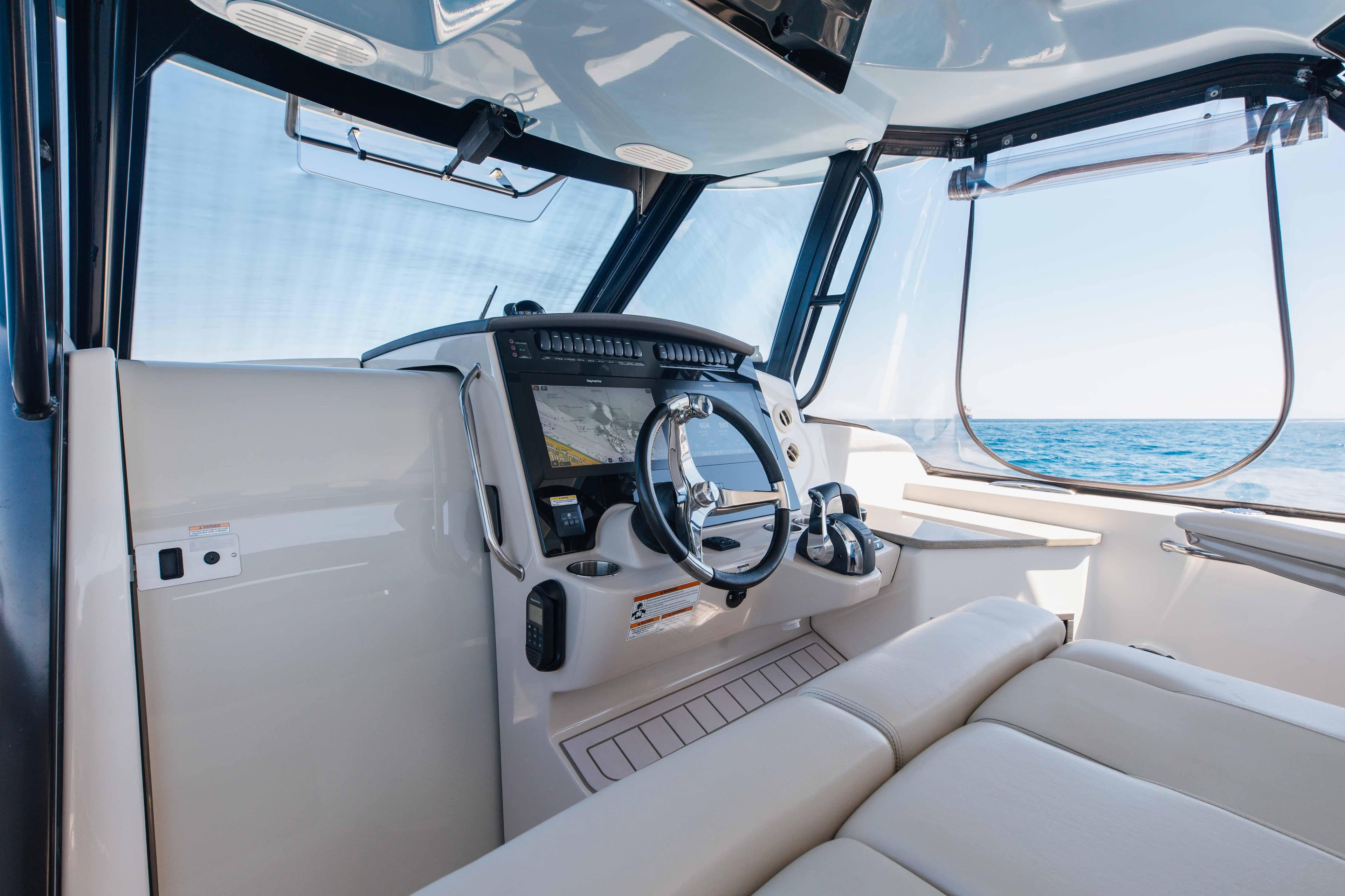 2021 Boston Whaler 350 Realm helm with modern controls and ocean view.