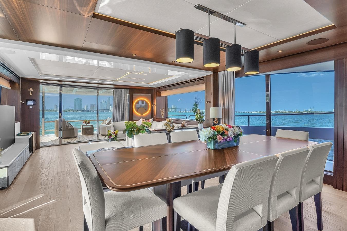 Luxurious interior of 2024 Sunseeker 88 Yacht with elegant dining area and ocean views.