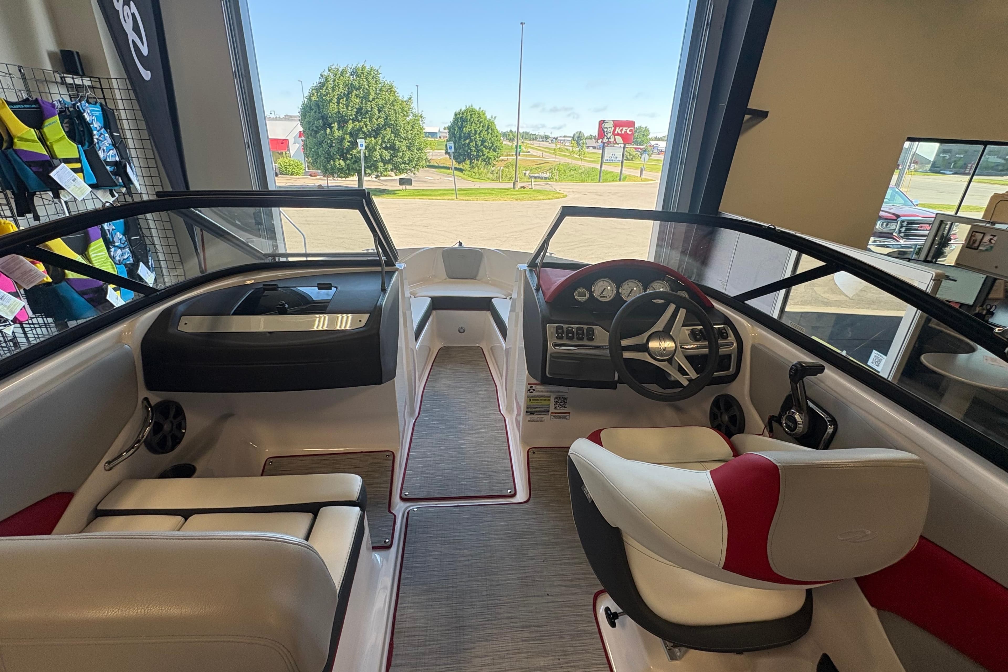 Interior view of 2019 Regal 1900 ES Bowrider boat, featuring steering wheel and seating.