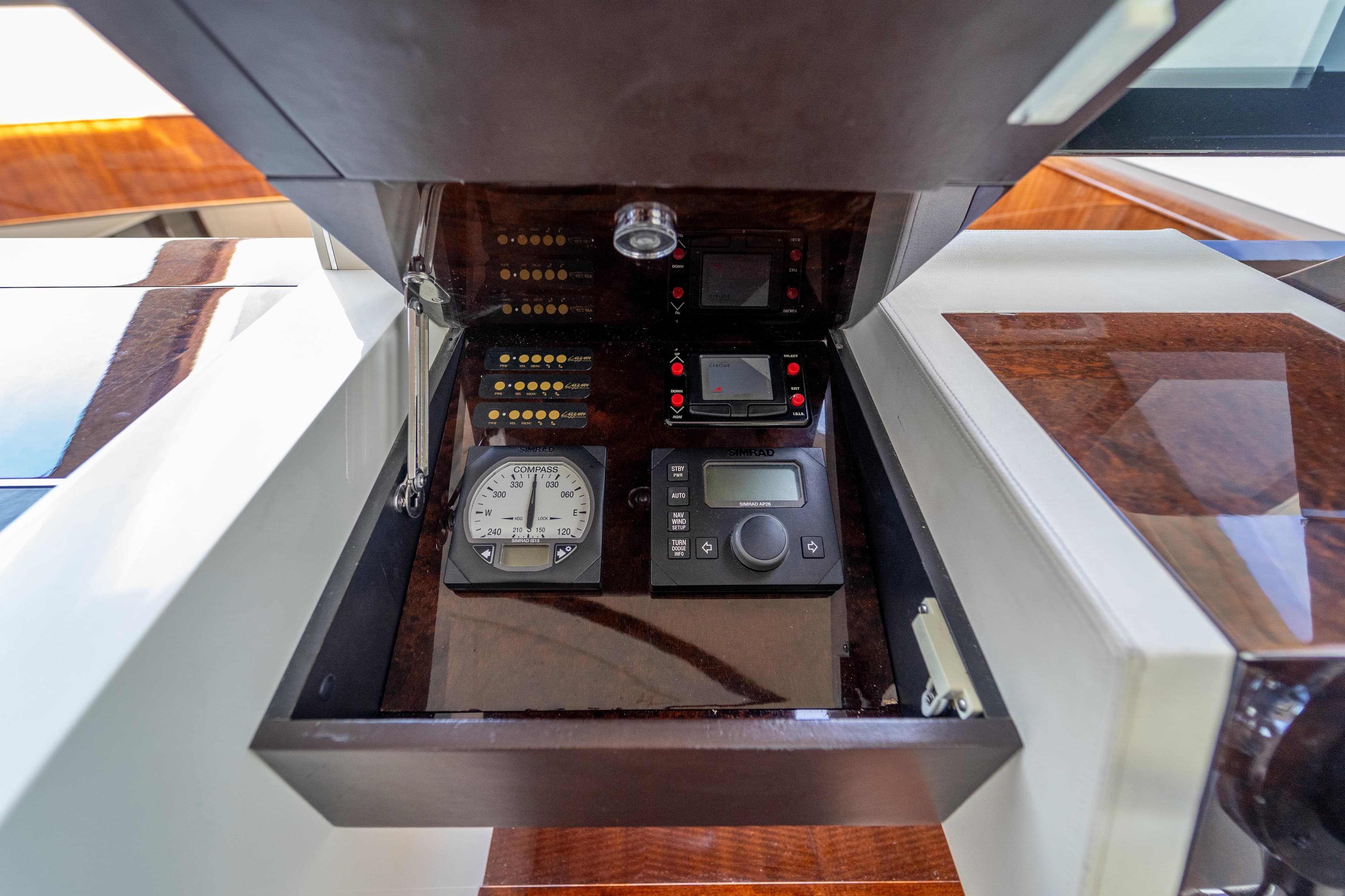 Control panel of 2009 Lazzara LSX 75 yacht with navigation instruments and compass.