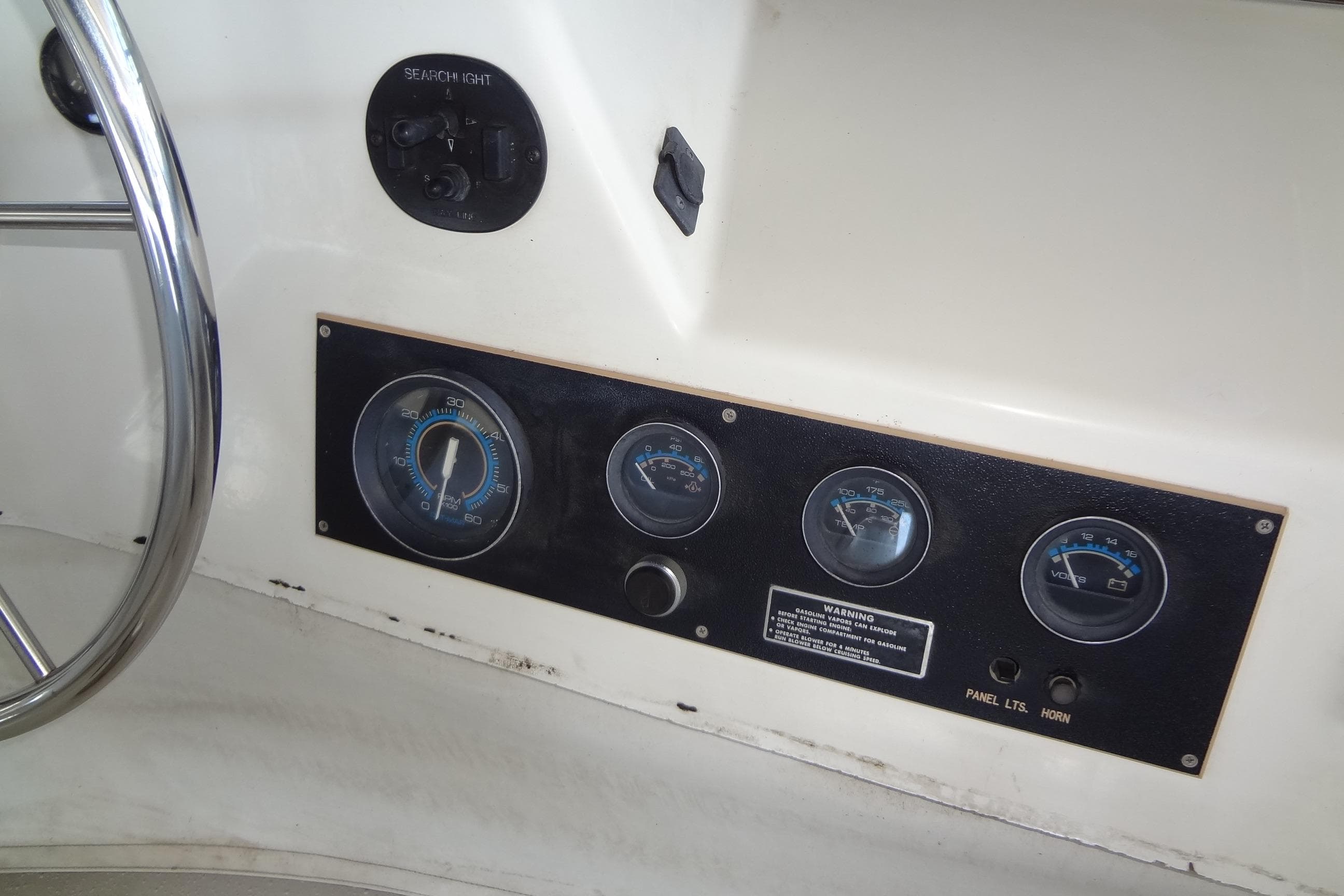 Control panel of a 1995 Harbor Master 52 boat with gauges and switches.