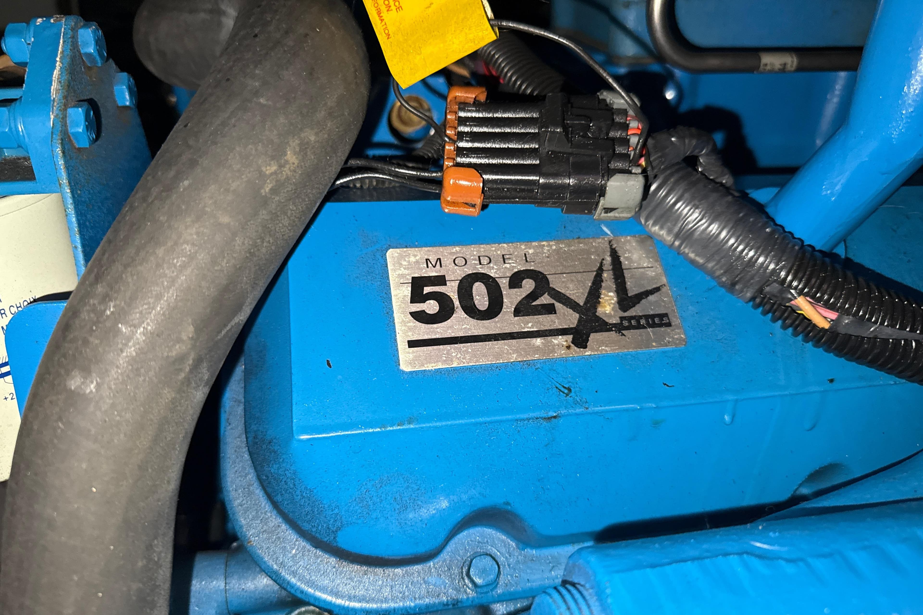 Engine compartment of a 1999 Silverton 422 Motor Yacht, featuring Model 502 XL Series.