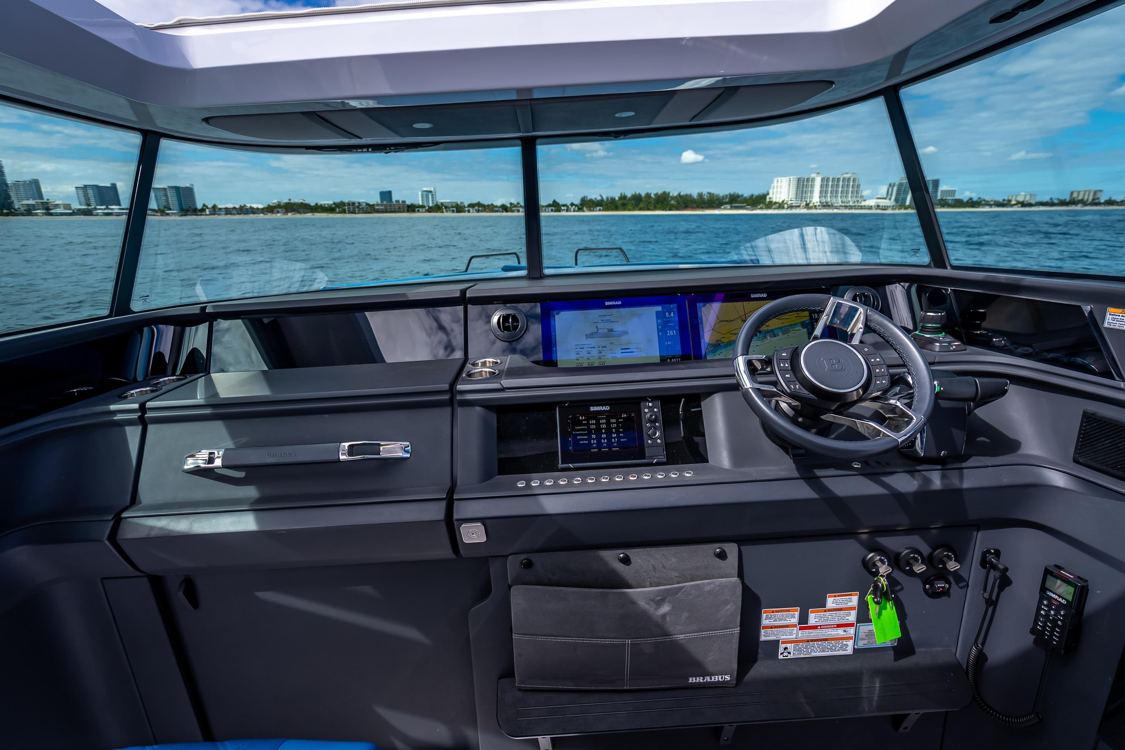 Helm of 2025 Axopar 45 Cross Top boat with modern navigation system.