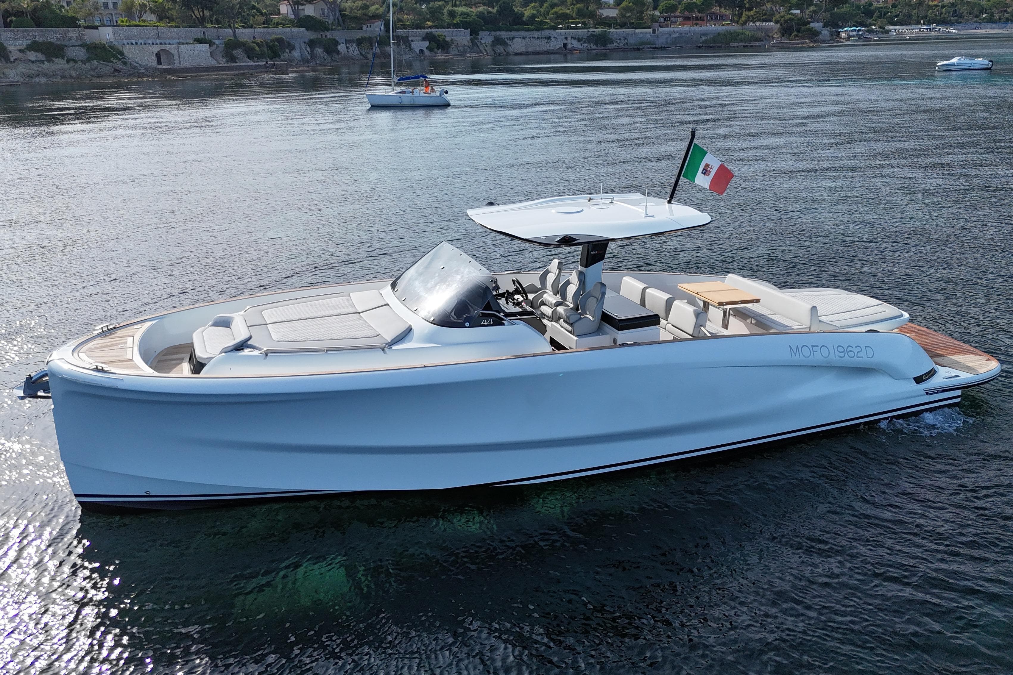 2024 Solaris 44 yacht on calm water, featuring sleek design and Italian flag.
