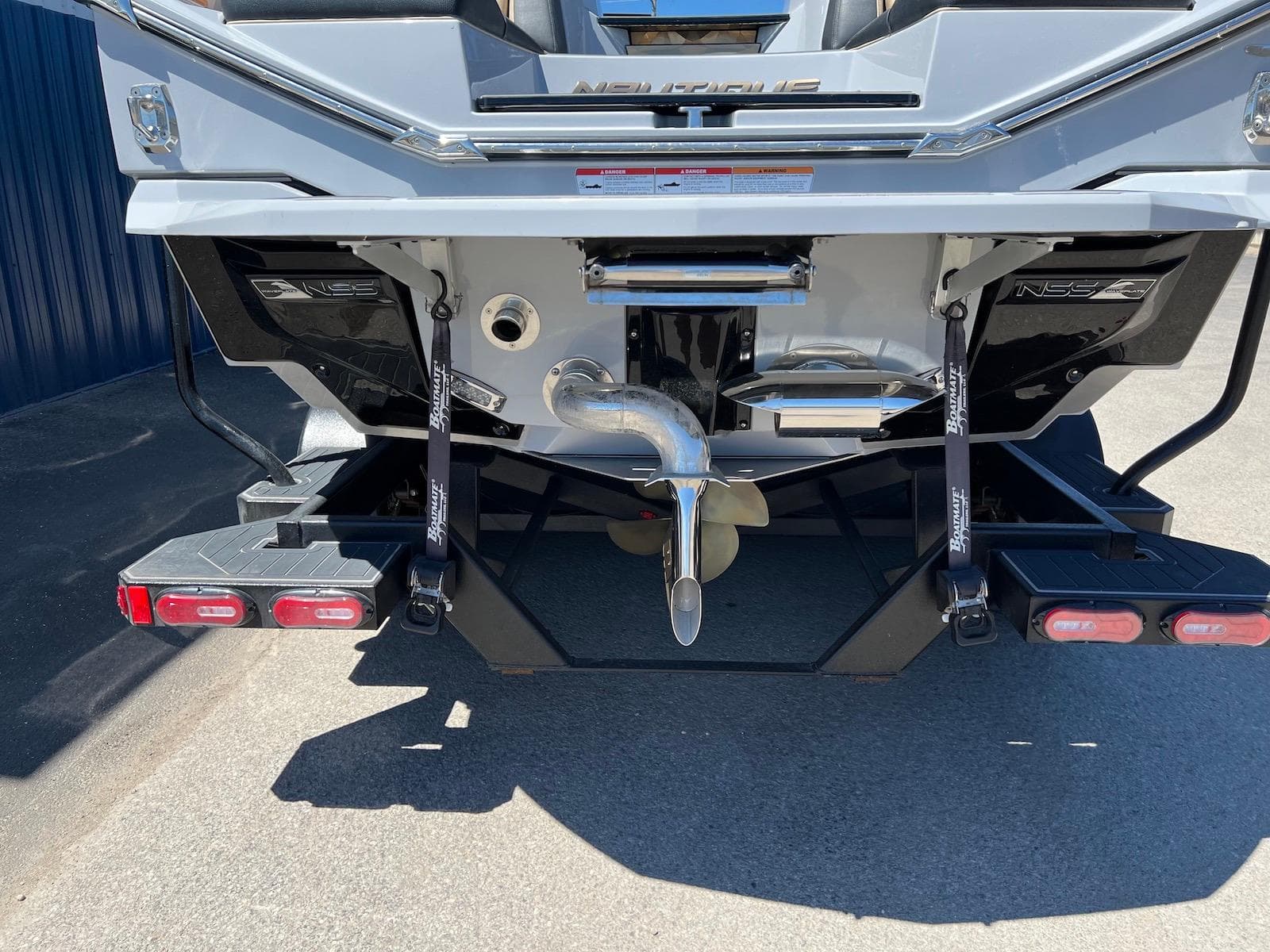 2022 Nautique Super Air Nautique G23 Paragon boat rear view, showcasing propeller and design features.