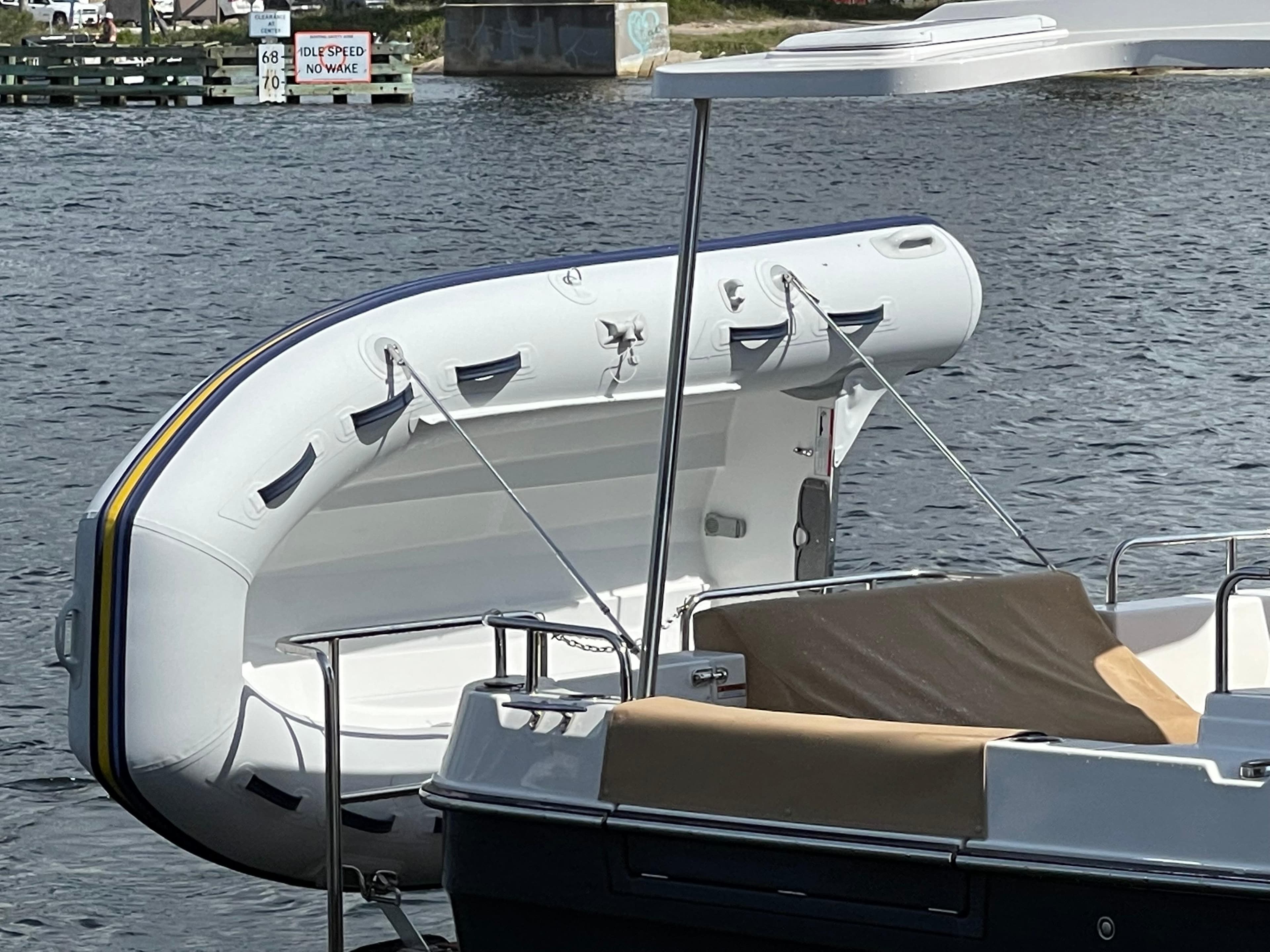 2023 Ranger Tugs R-31 CB with inflatable dinghy on water.