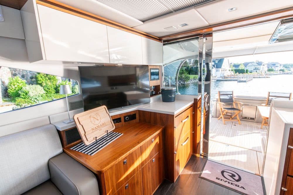 Interior of 2022 Riviera 6000 Sport Yacht Platinum with modern design and waterfront view.