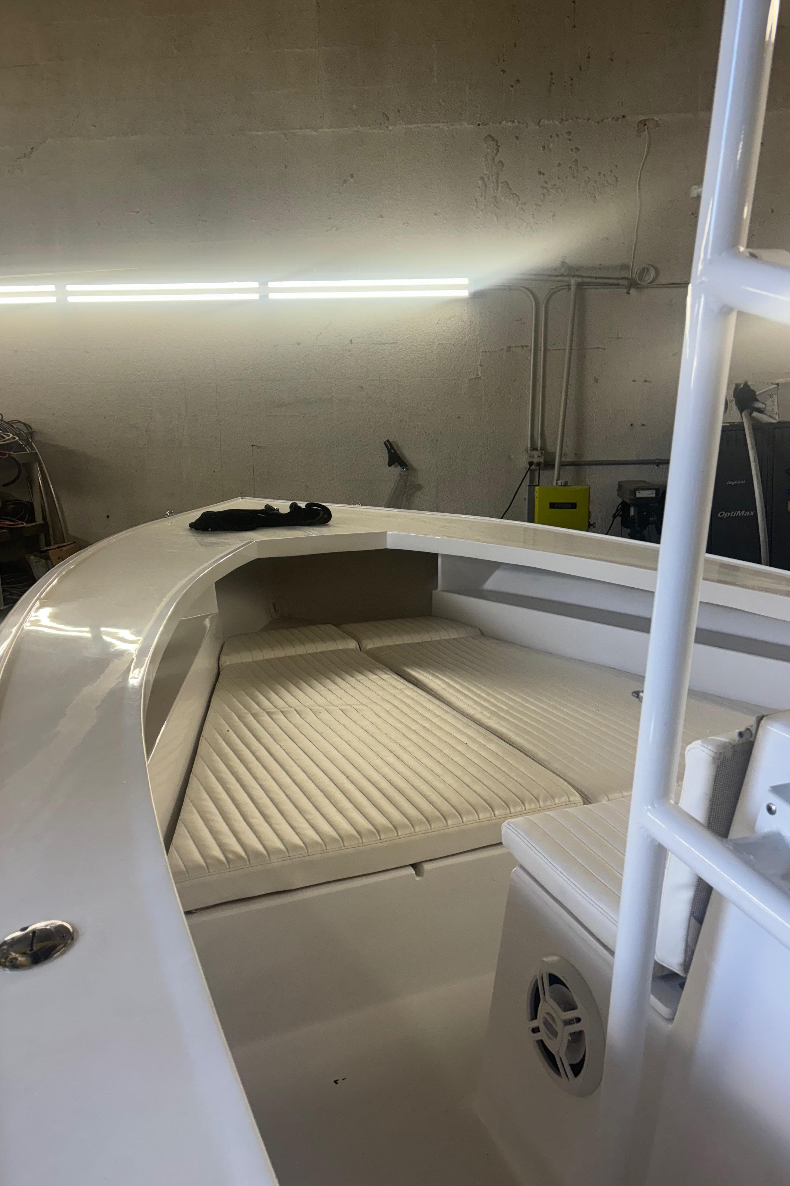 1971 SeaCraft Barcone 21 CC boat interior with cushioned seating in a garage.