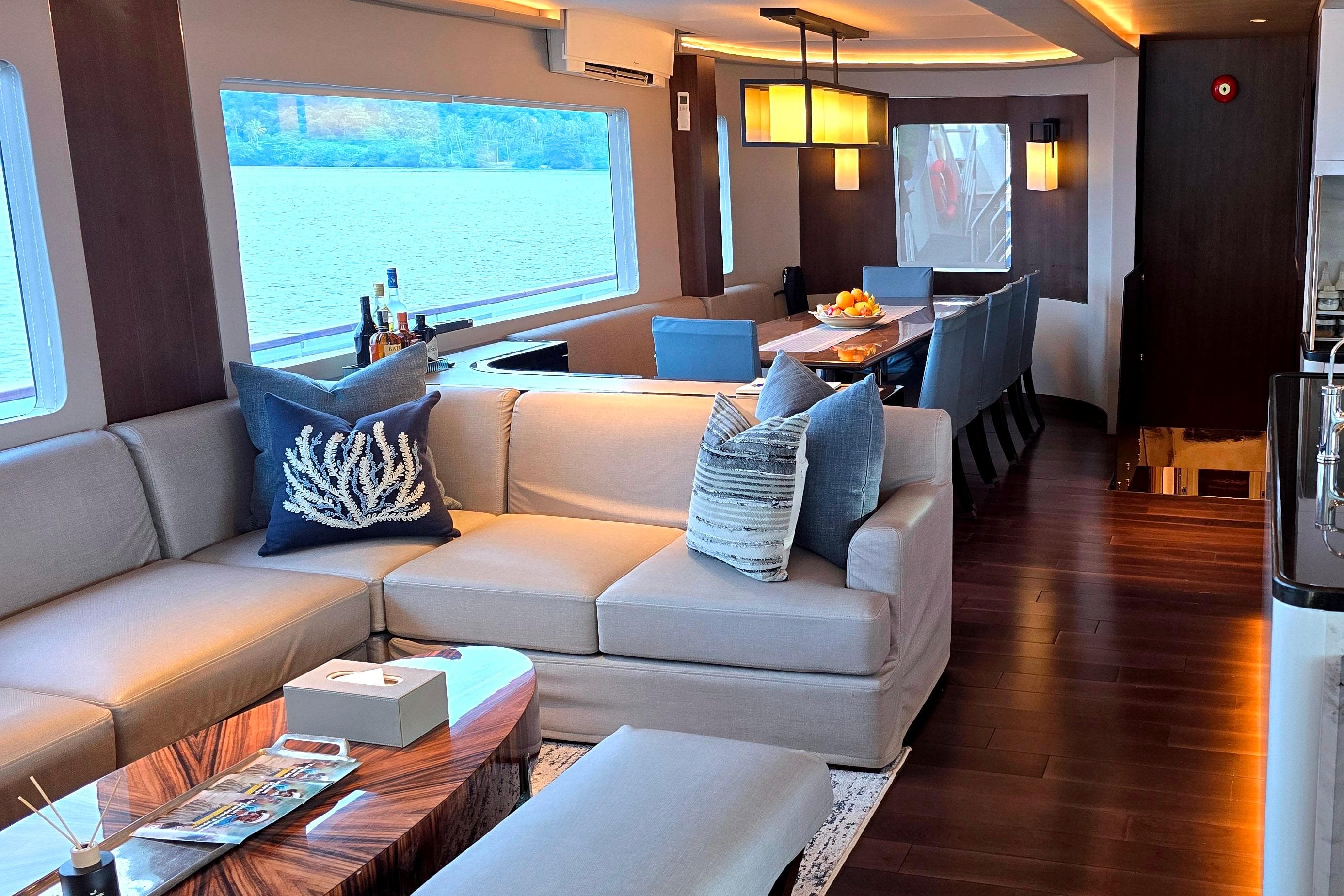 Luxurious interior of 1998 Halter Marine 98 yacht with elegant seating and dining area.