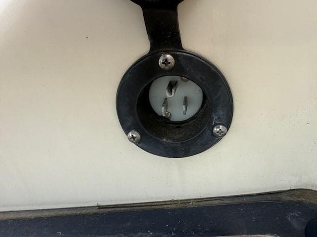 2014 Chris-Craft Launch 25 boat power outlet close-up.