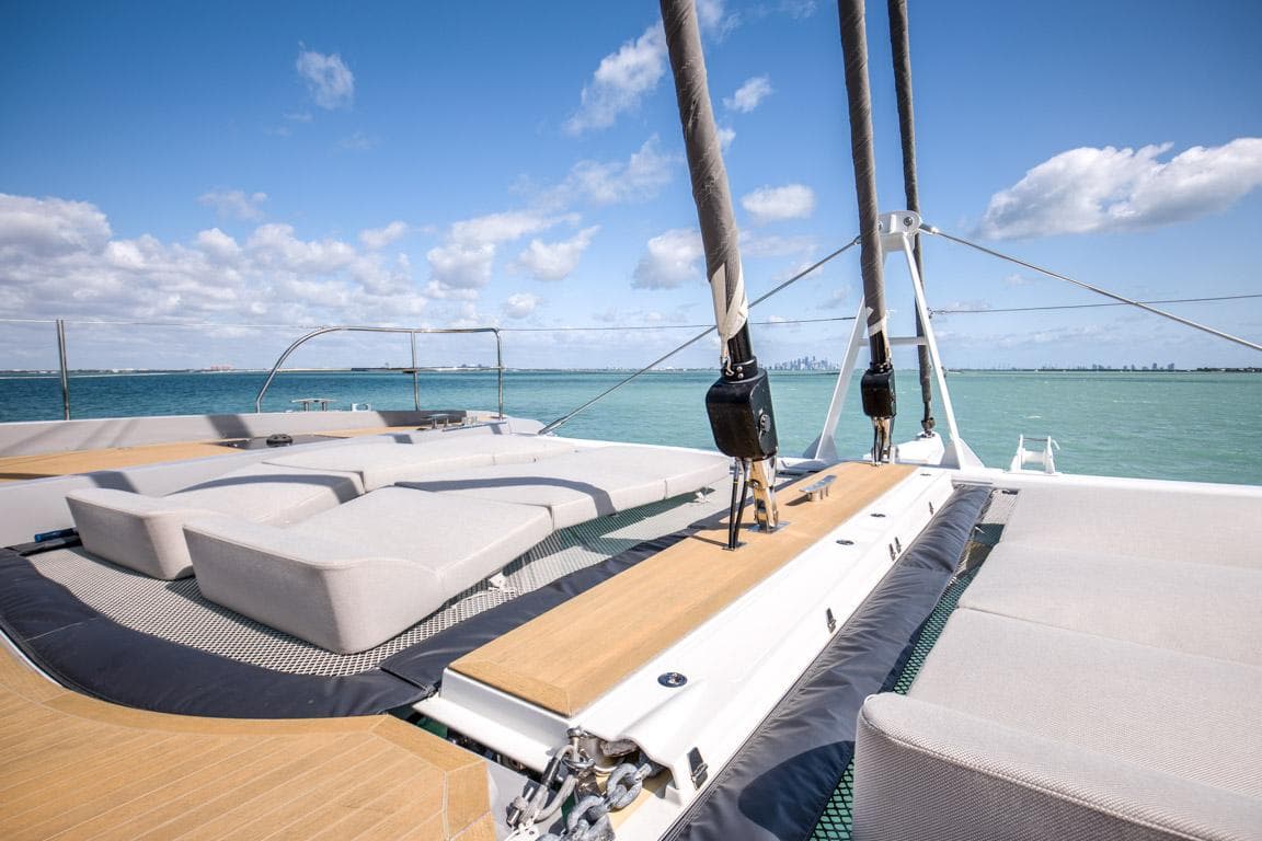 Luxurious 2020 Lagoon SEVENTY 7 yacht deck with sun loungers and ocean view.