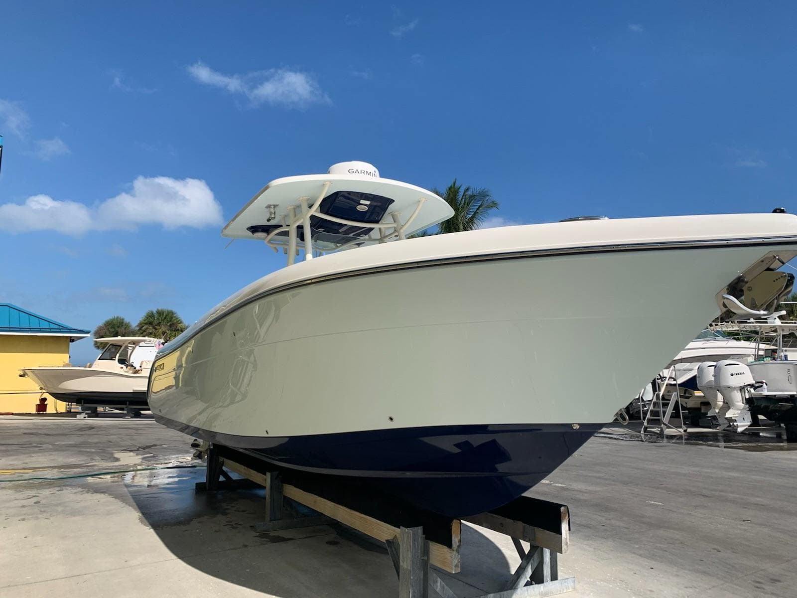 2019 Century 3200 Center Console boat on display under clear blue sky.