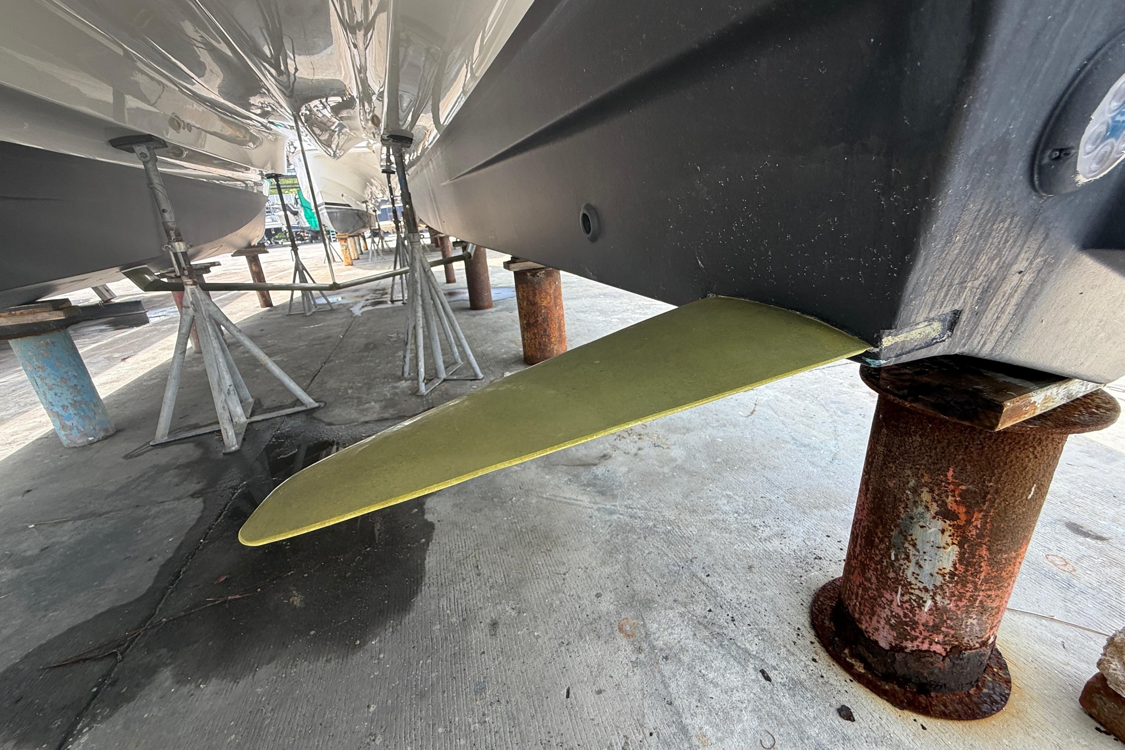 Underwater view of 2021 Aquila 36 Sport boat hull on dry dock.