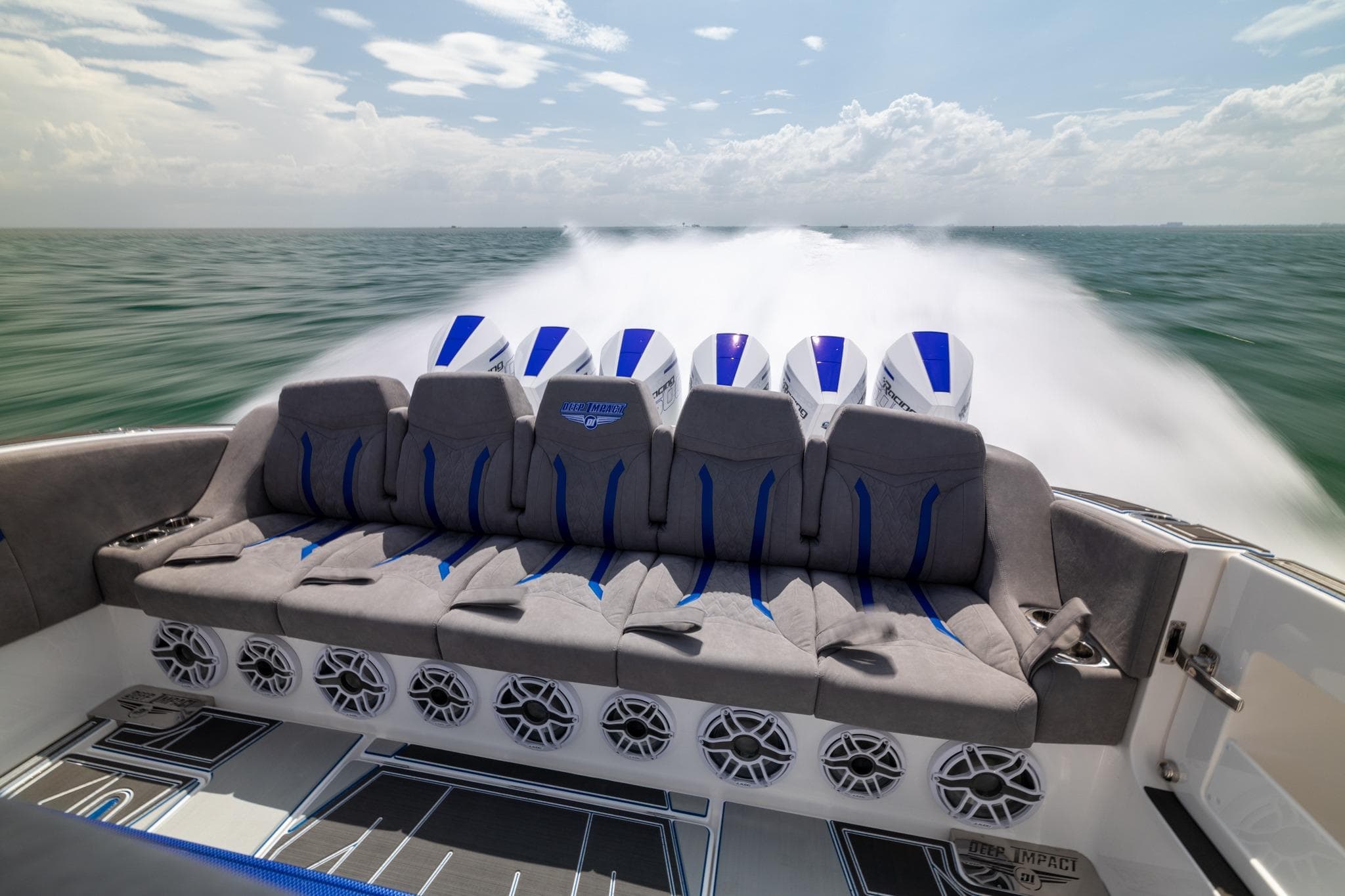 2027 Deep Impact 449 Sport boat speeding on open water, showcasing powerful engines and sleek design.