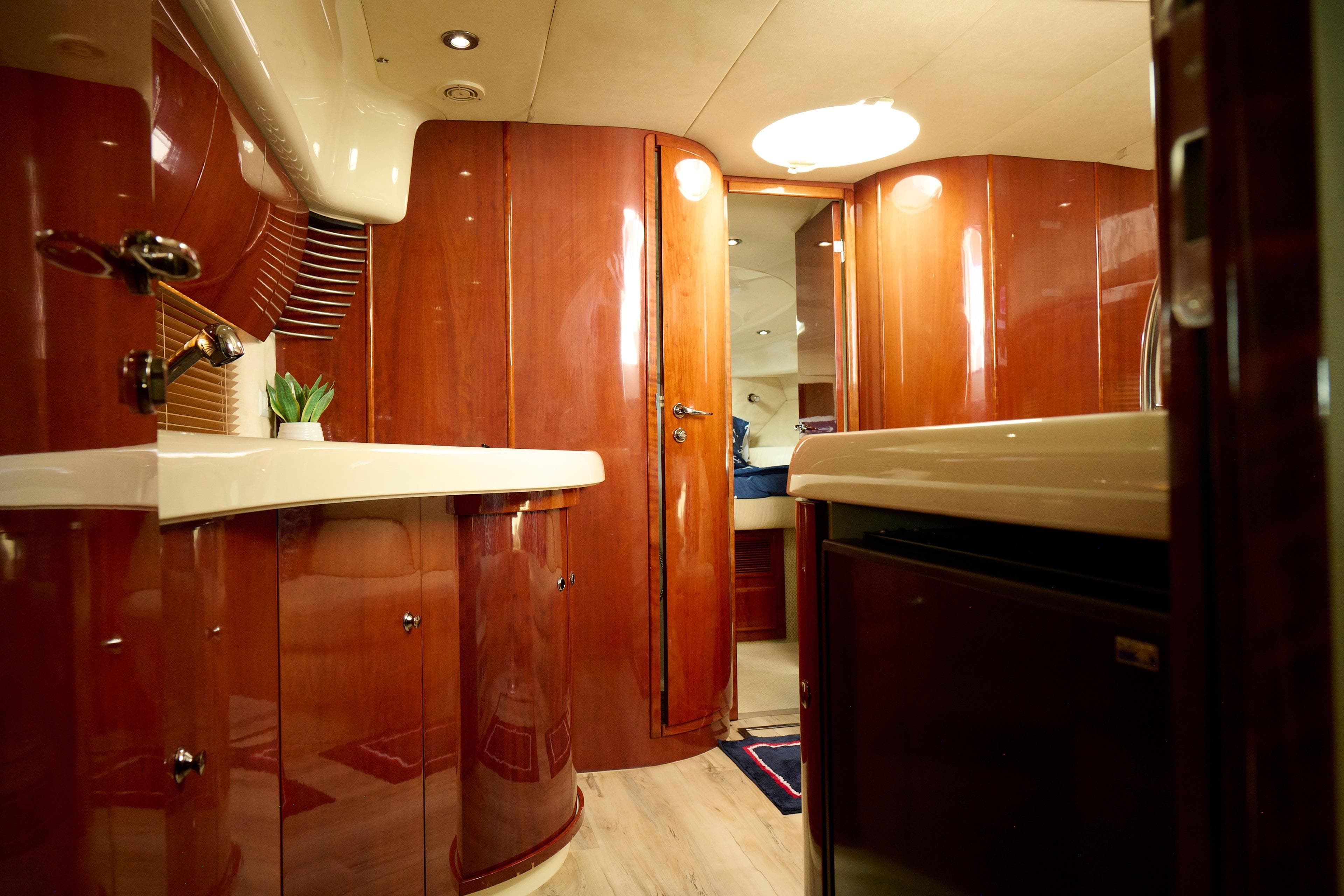 Luxurious interior of a 2001 Fairline 43 yacht with polished wood finishes.