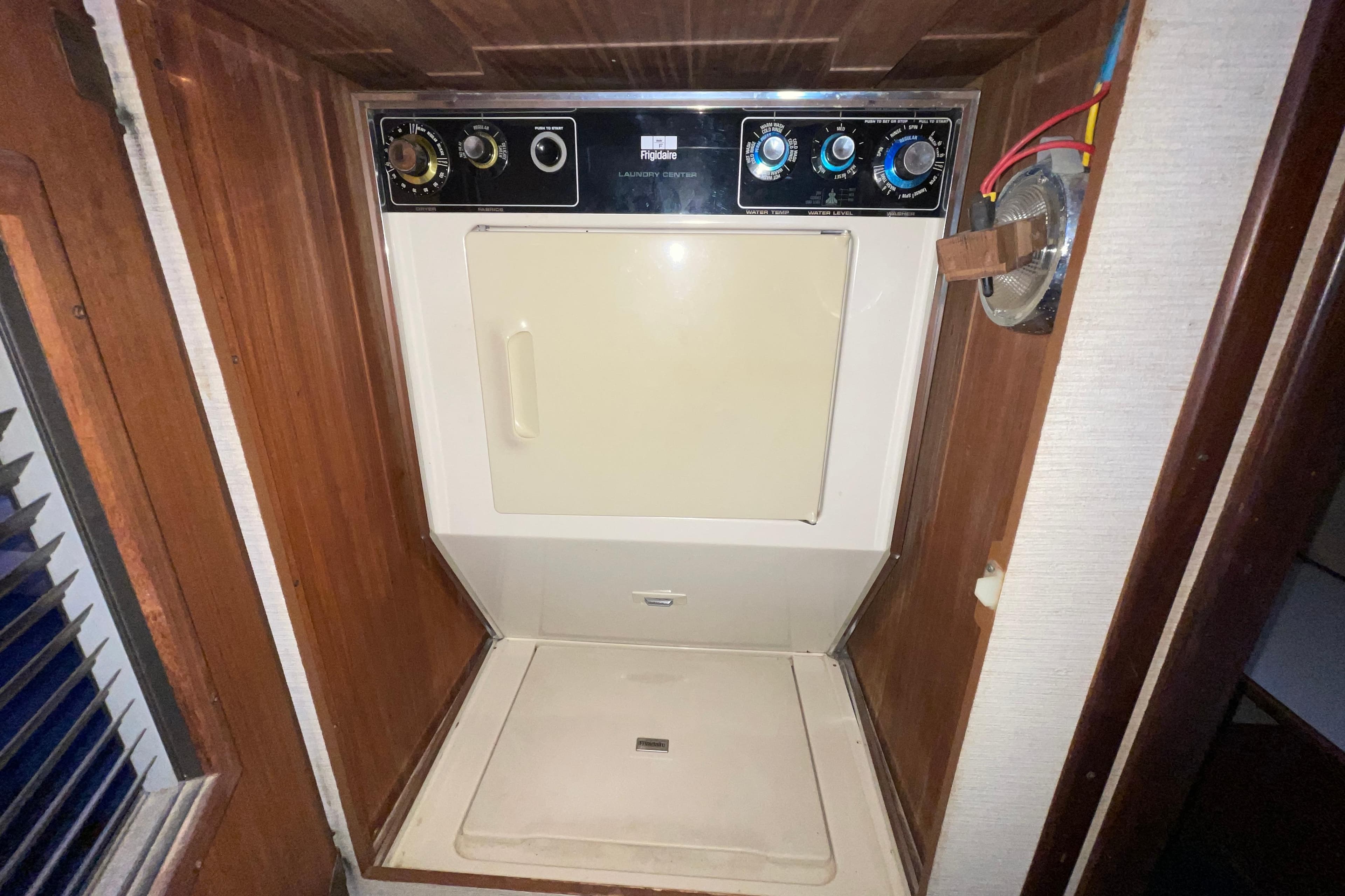 Laundry area with vintage dryer in 1981 Hatteras 48 Motor Yacht.