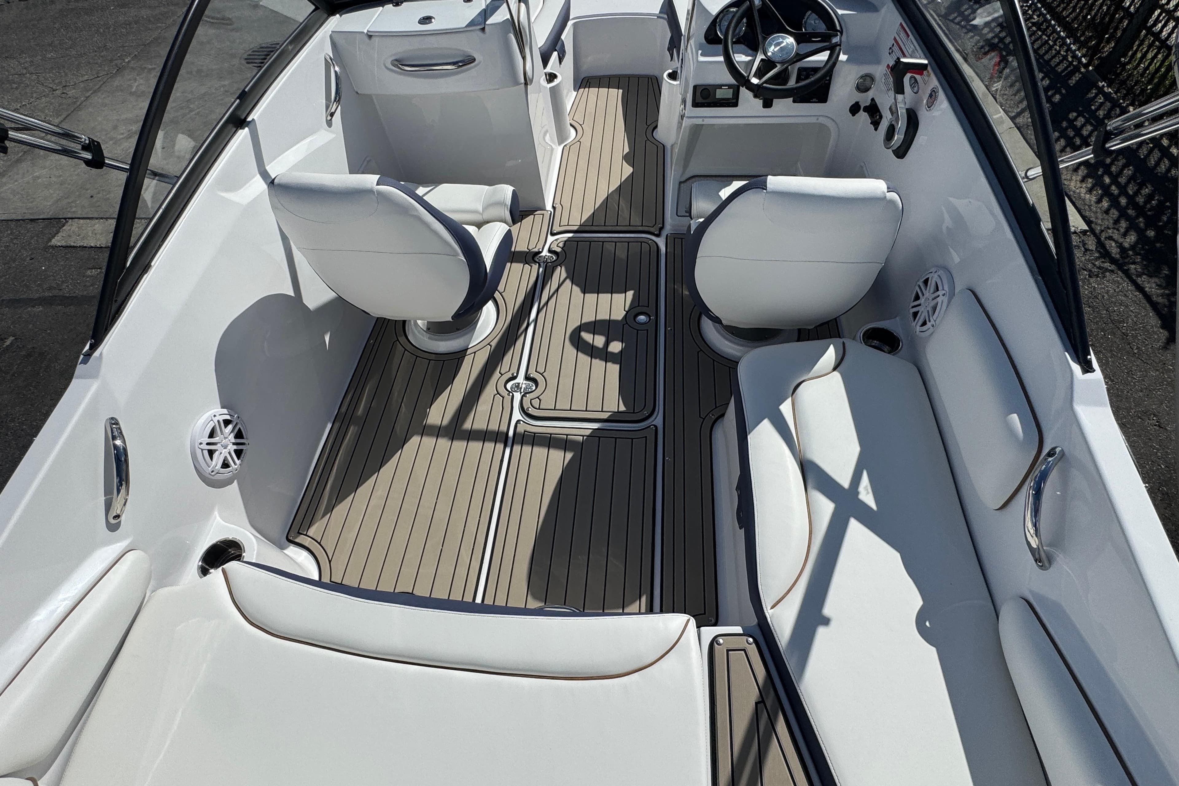 2026 Stingray 191 DC boat interior with sleek seating and modern steering console.