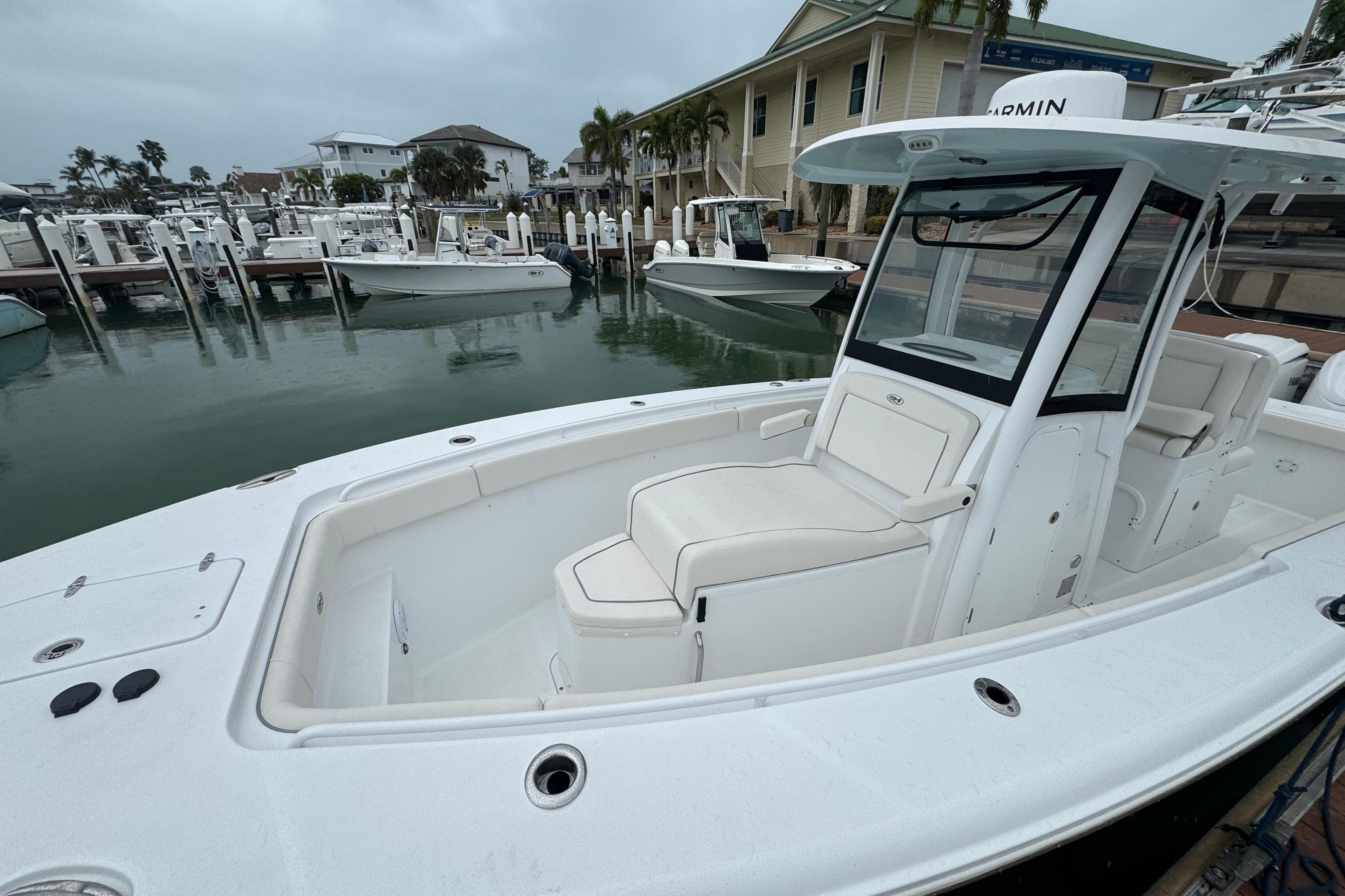 2024 Sea Hunt Gamefish 27 Coffin Box boat docked at marina, showcasing sleek design.