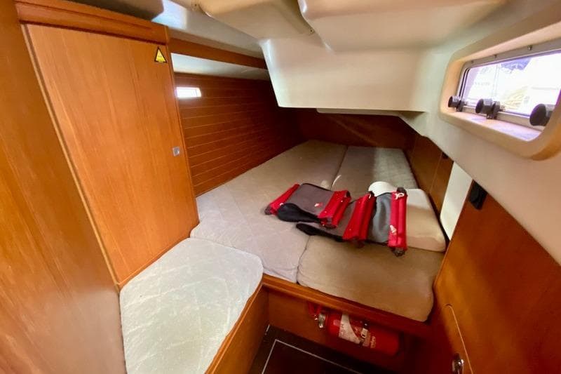 Cozy cabin interior of 2008 Dehler 44 SQ yacht with wooden finish.