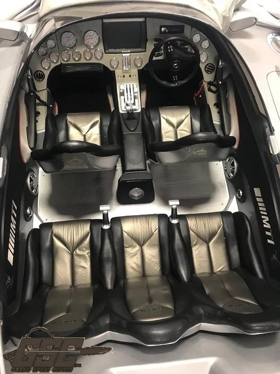 2007 MTI 44 AMG TRIBUTE boat interior with leather seats and modern dashboard.