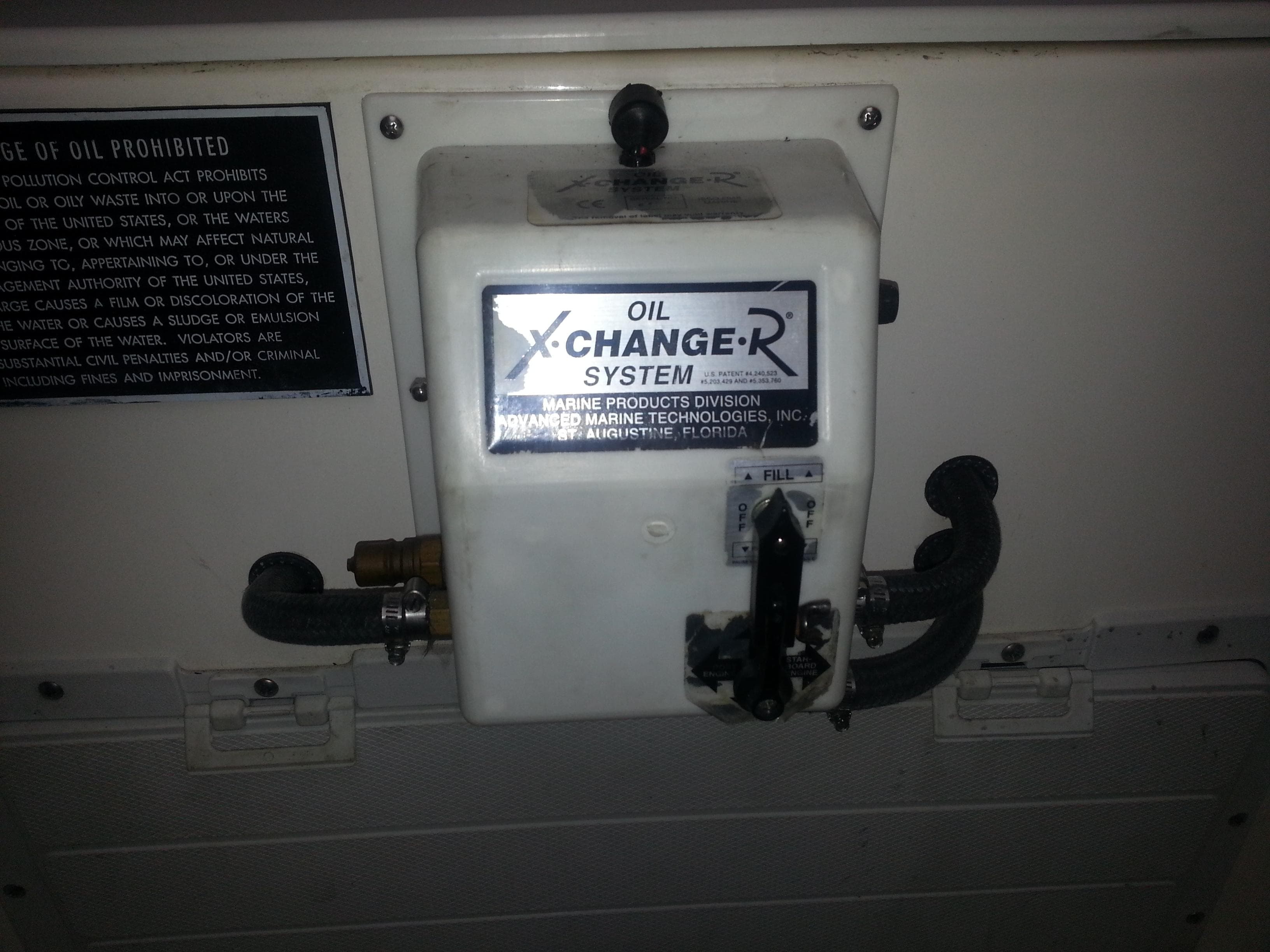 Oil change system on a 2001 Cabo 35 Express boat.
