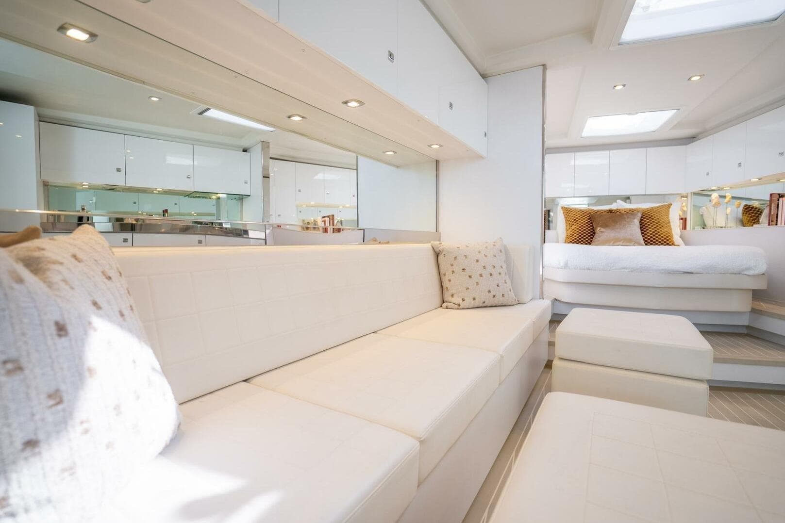 Luxurious interior of 2016 VanDutch 55 yacht with elegant white seating and modern decor.