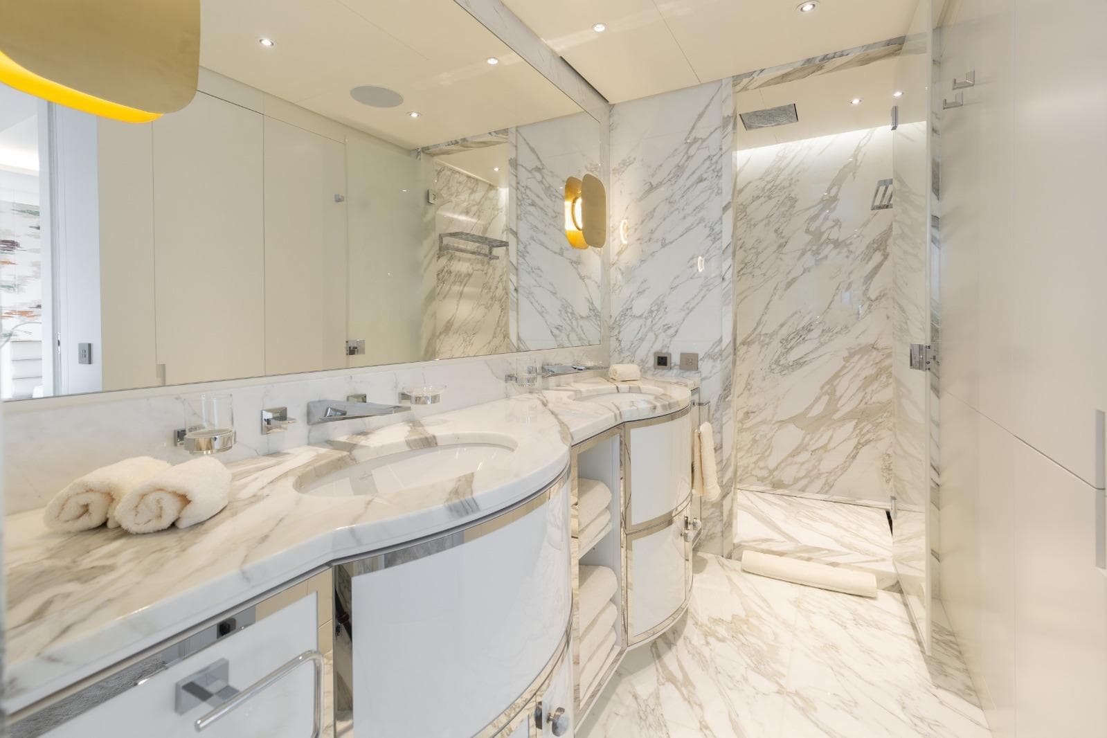 Luxurious marble bathroom in 2022 Versilcraft 138 yacht, featuring elegant fixtures and modern design.