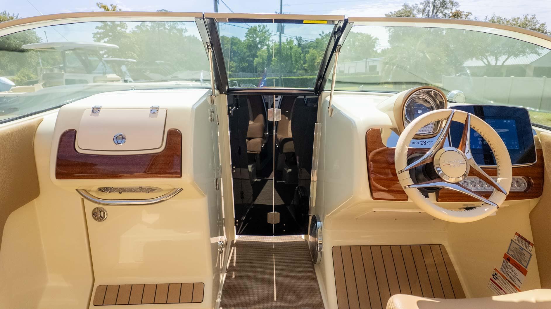 2025 Chris-Craft Launch 28 GT boat interior with steering wheel and dashboard.