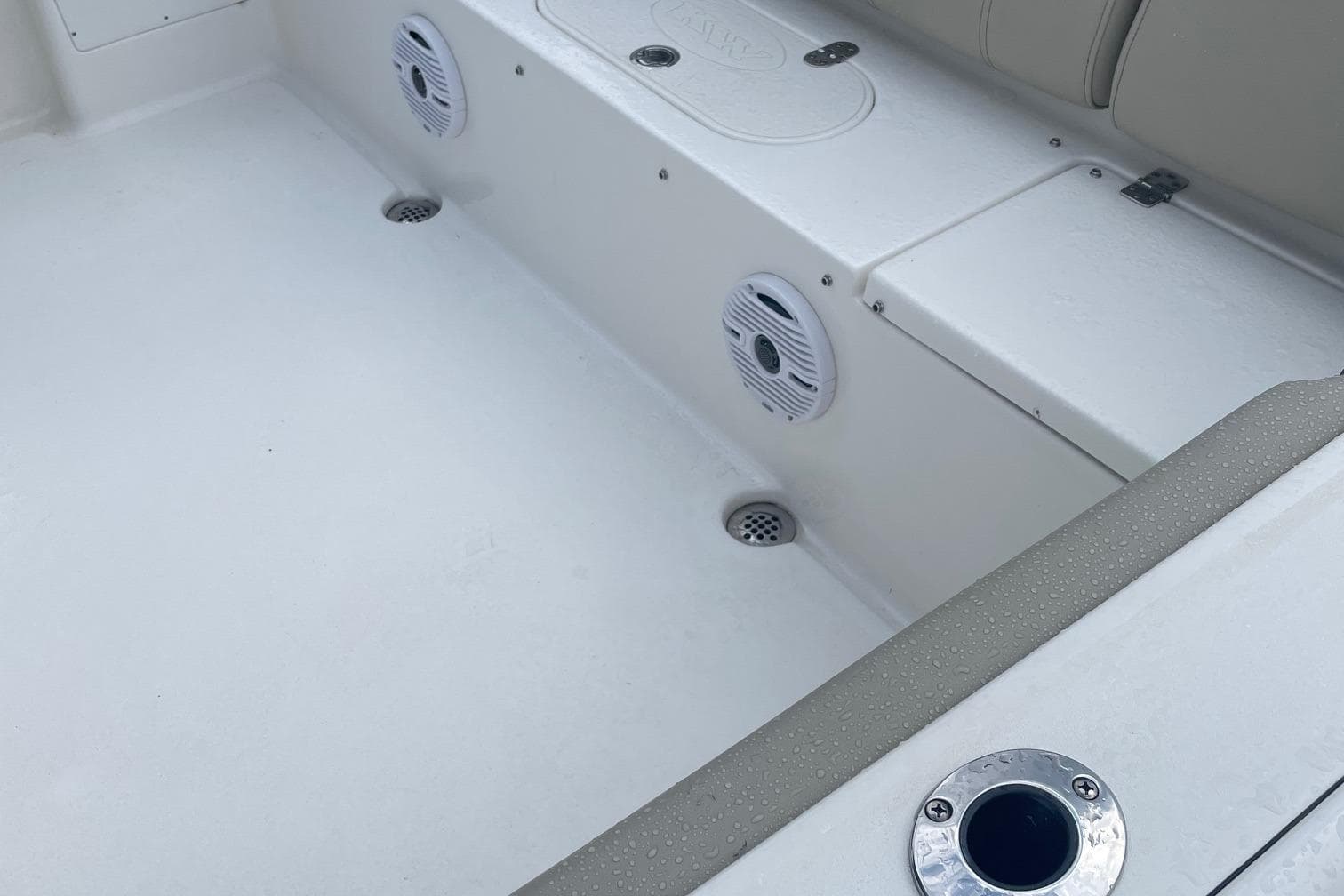 2024 Key West 239 FS boat interior with speakers and seating area.