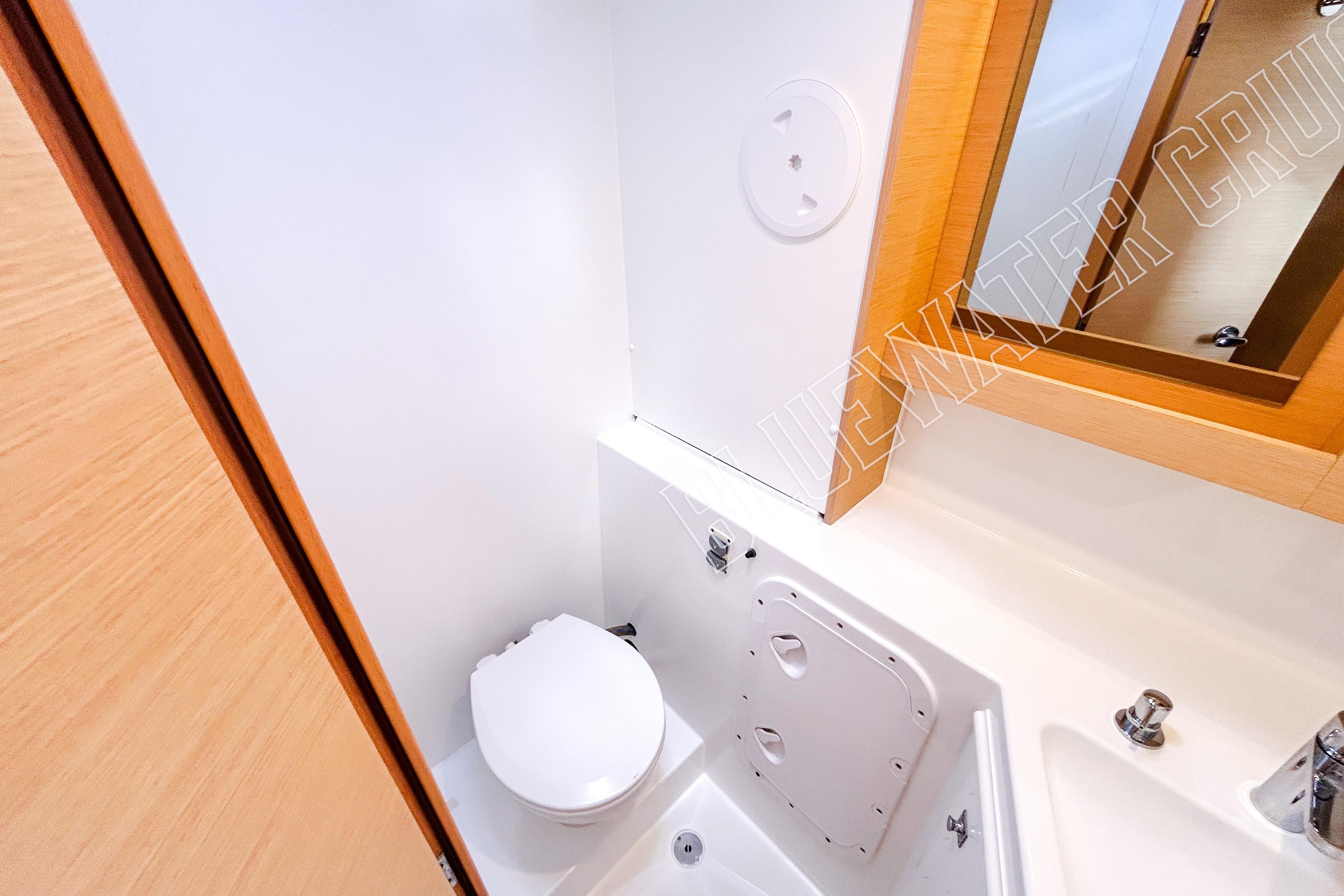 2018 Lagoon 42 yacht bathroom with modern fixtures and wooden accents.